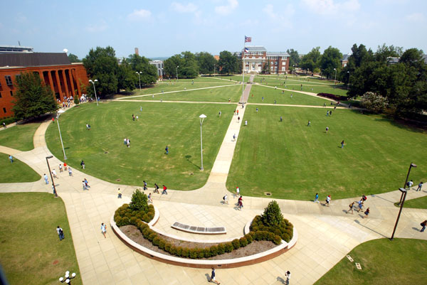 Students walk across Drill Field between classes