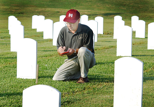 Wayne Philley measures grass for Tombstone research