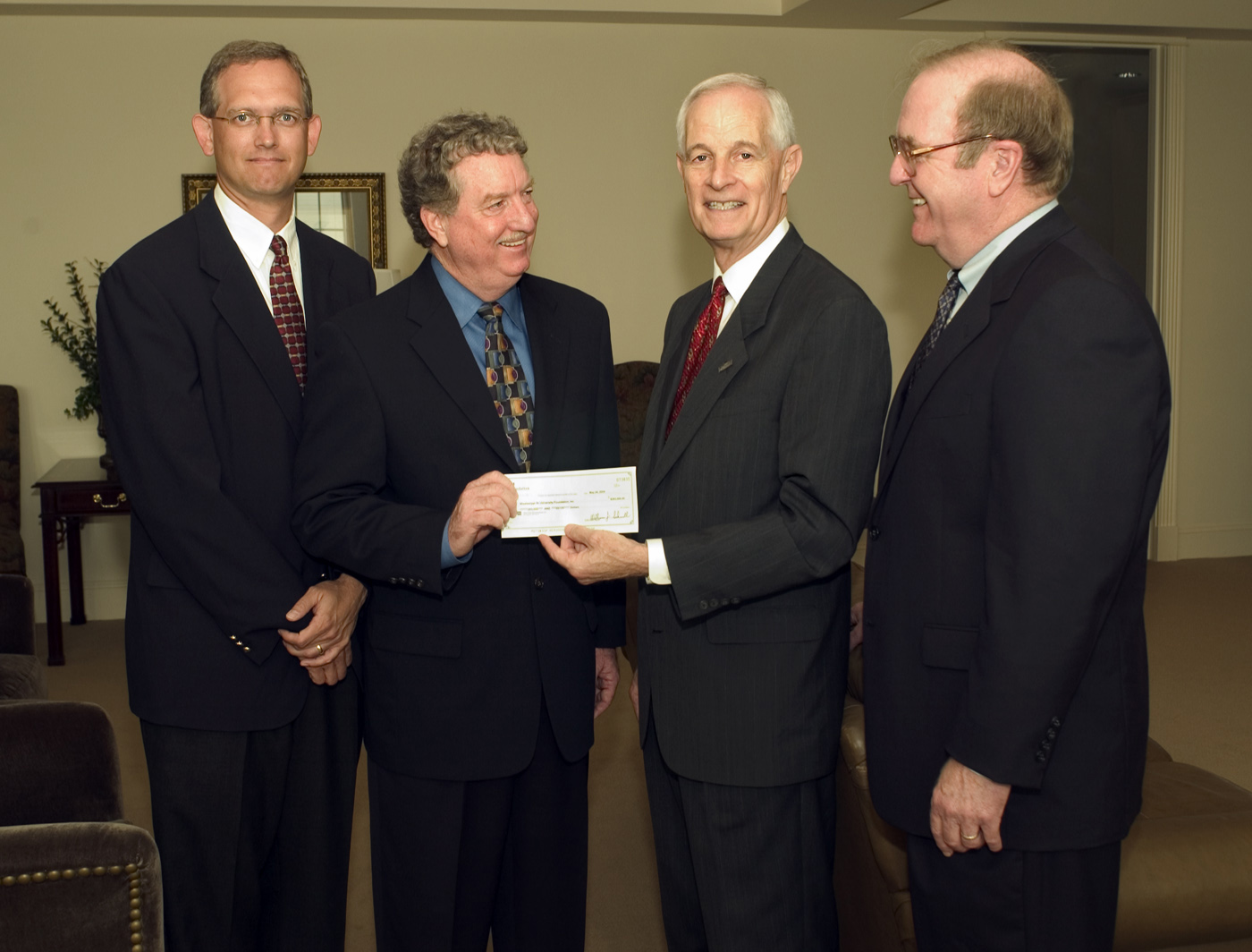 <br /><br />
3M representatives (l-r) Brian Schoebel and Larry Thomason present a check to Bagley College of Engineering dean A. Wayne Bennett and industrial engineering department head Larry Brown as the first installment of more than $500,000 the St. Paul, Minn.-based company will provide over two years to establish a Six Sigma Certificate program at MSU. The program is designed to provide engineering students with the latest methods of ensuriing customer satisfaction through quality control.<br /><br />
 