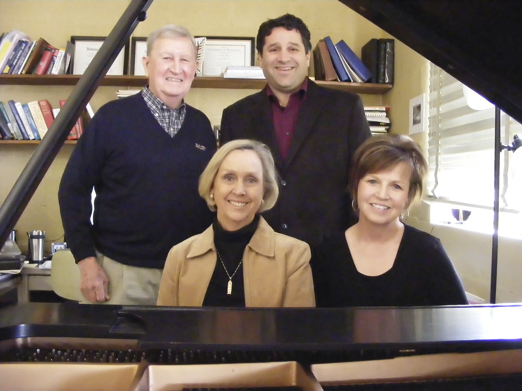 Nancy Hargrove (seated, left) and Karen Murphy, with Guy Hargrove (standing, left) and Brian Nedvin.