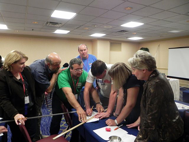 ATOMS2xp project director Betty Latimer (far right) directs teachers in a hands-on learning activity during the Mississippi Science Teachers Association annual conference in Jackson.