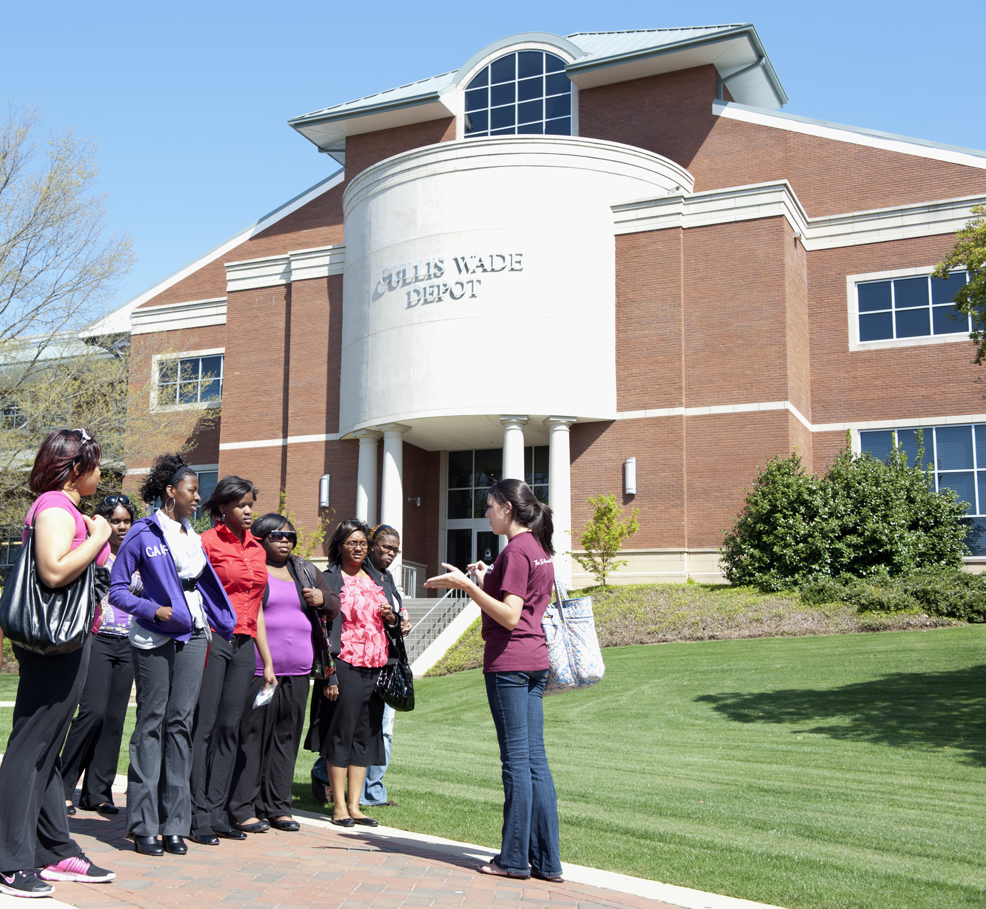 A Maroon VIP student volunteer gives a tour to a group visiting Mississippi State. The tours begin at the MSU Welcome Center in the Cullis Wade Depot.