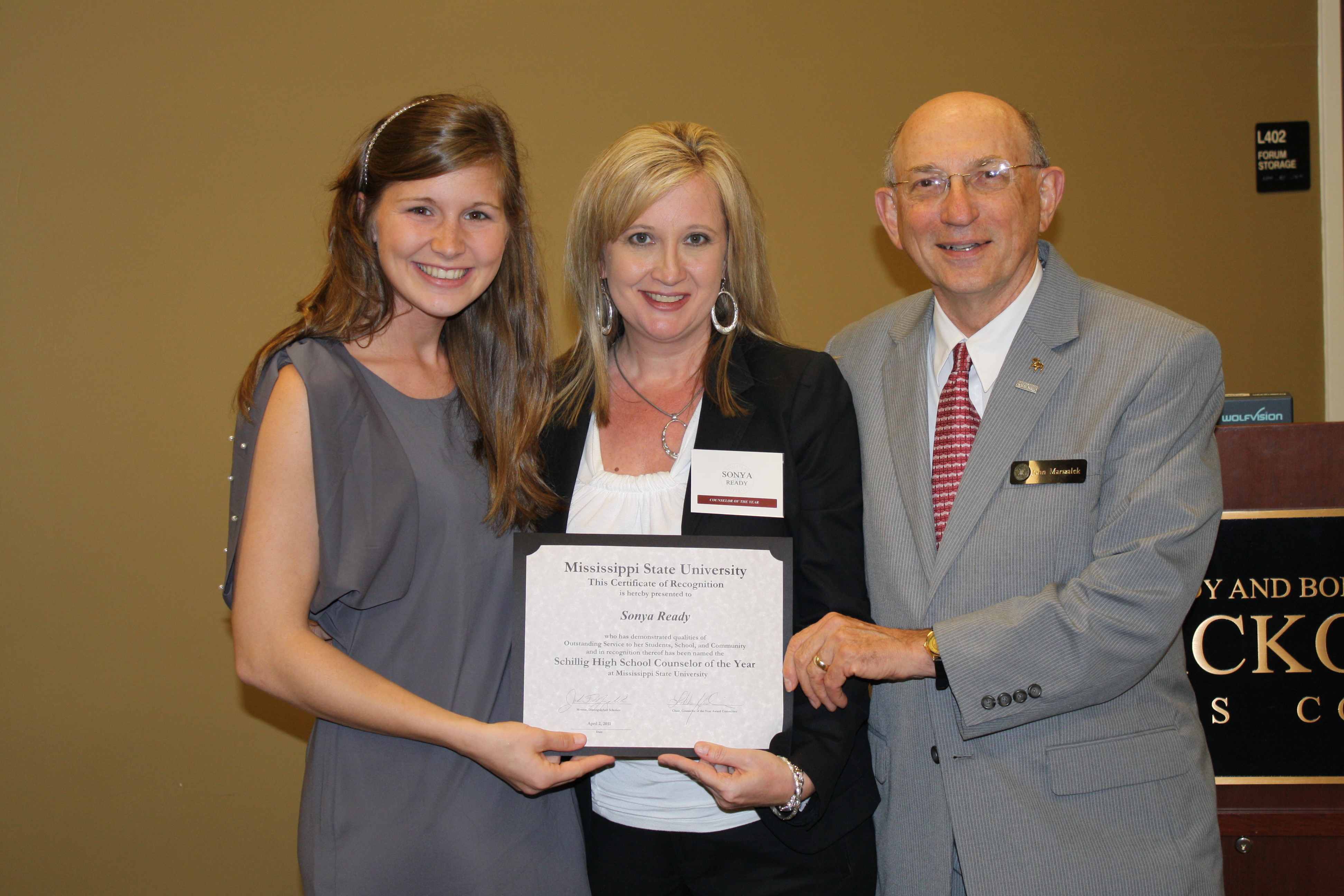 Sonya Ready of Stringer Attendance Center, center, is named the 2011 Counselor of the Year. She is congratulated by Libbo Haskins, left, chair of the MSU High School Counselor of the Year committee, and John Marszalek, director and mentor of the scholars program.