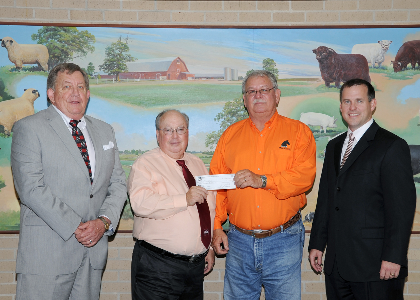 James Watts (from left), MSEA executive director; Terry Kiser, retiring head of MSU's animal and dairy sciences department; James Rasberry, MSEA president; and Jud Skelton, College of Agriculture and Life Sciences development director.