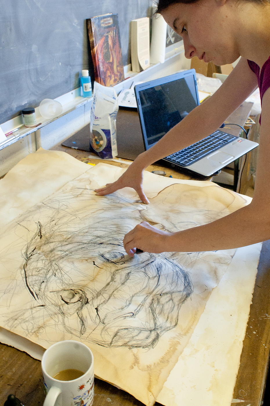 Senior art major Kathleen O'Hear of Starkville works on her series of field studies.