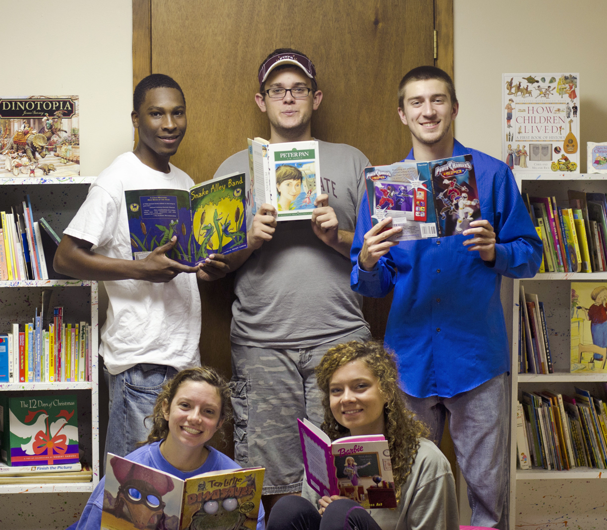 As part of the 44 teams in the Day One Leadership Community at Mississippi State University, the Happy Heroes led a book drive that collected more than 600 books, built two bookcases and mentored children at the Happy Start Learning Center on Highway 82. Participating students are, standing left to right, Michael Houston of Lyon; Tyler Howell of Orlando, Fla.; Joshua Mellott of Hoschton,Ga.; and sitting, Hannah Weisenberger and Ramsey Rankin, both of Clinton. 