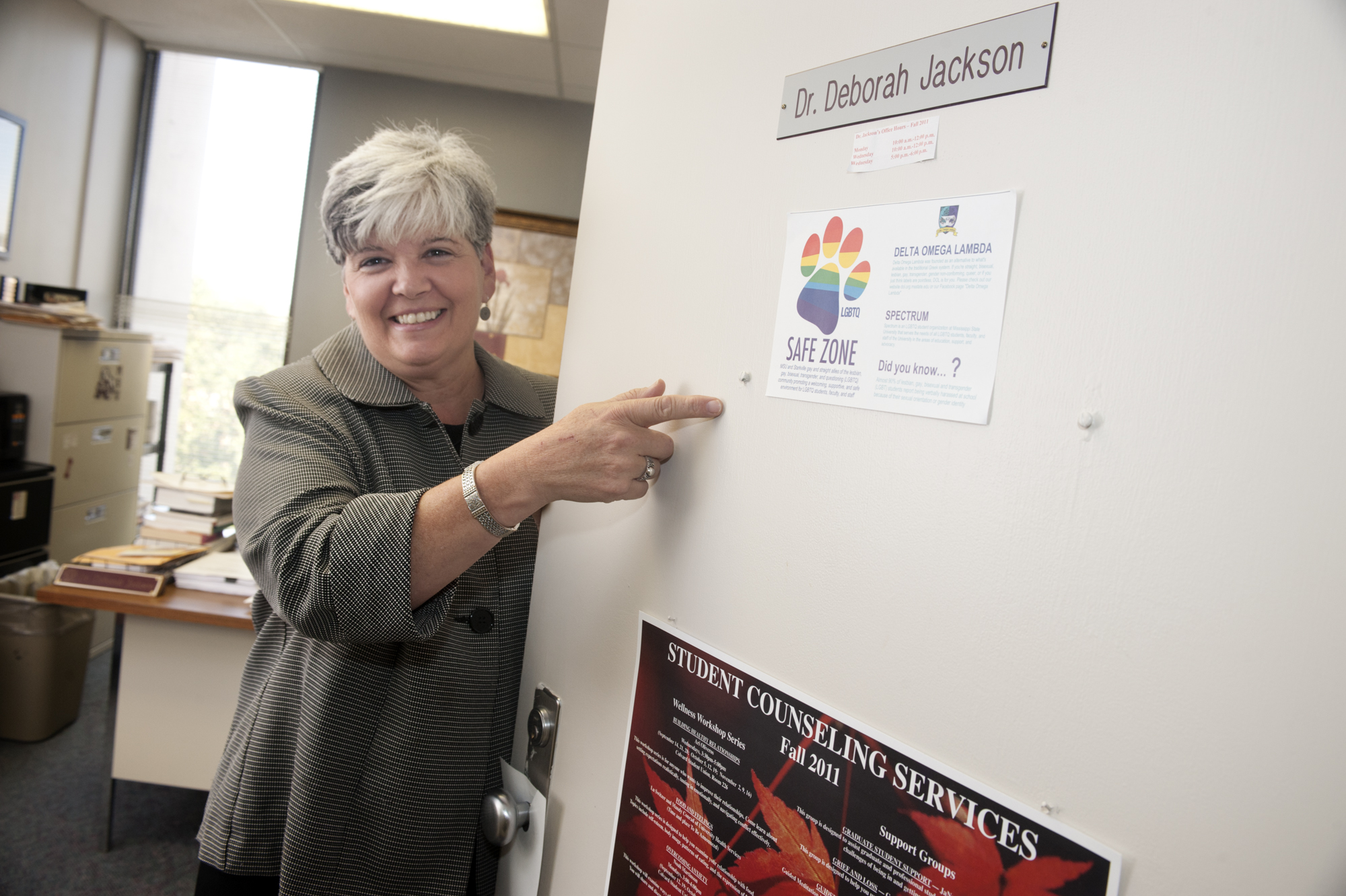 Deborah Jackson, an assistant professor in MSU's department of counseling and educational psychology, displays a Safe Zone office sticker.