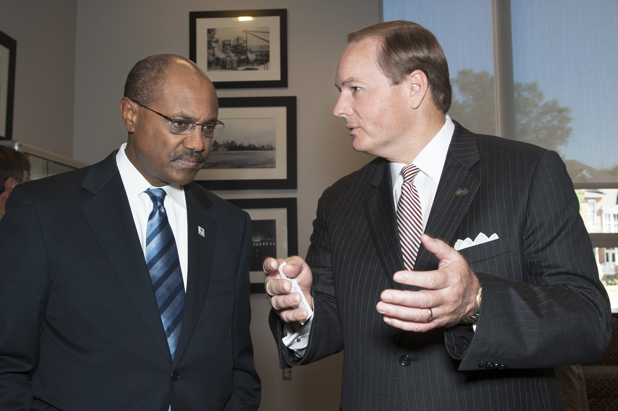 Daniel Yohannes, left, CEO of the Millennium Challenge Corp., listens as MSU President Mark E. Keenum, discusses the university's role in food safety research. 