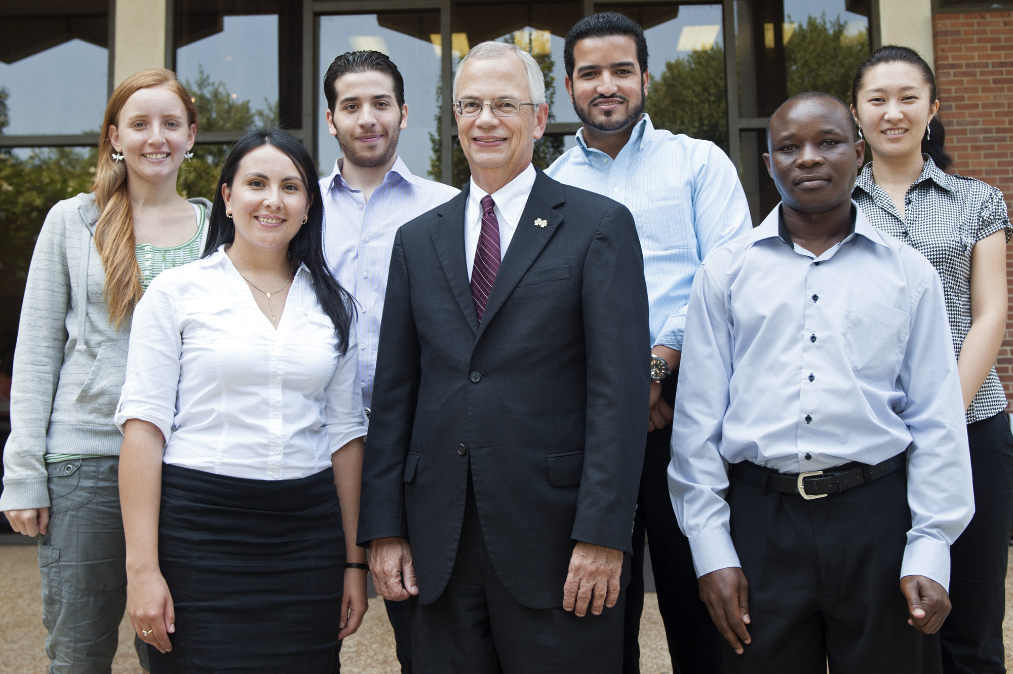 New Fulbright Scholars shown with MSU Provost and Executive Vice President Jerry Gilbert, center, are front row, (l-r), Gina Rico Mendez and Job Bonyo; and back row, (r-l) Rosanna Carreras de Leon, Mohammad Al Boni, Carlos Cabrera and Anara Kozhokanova.