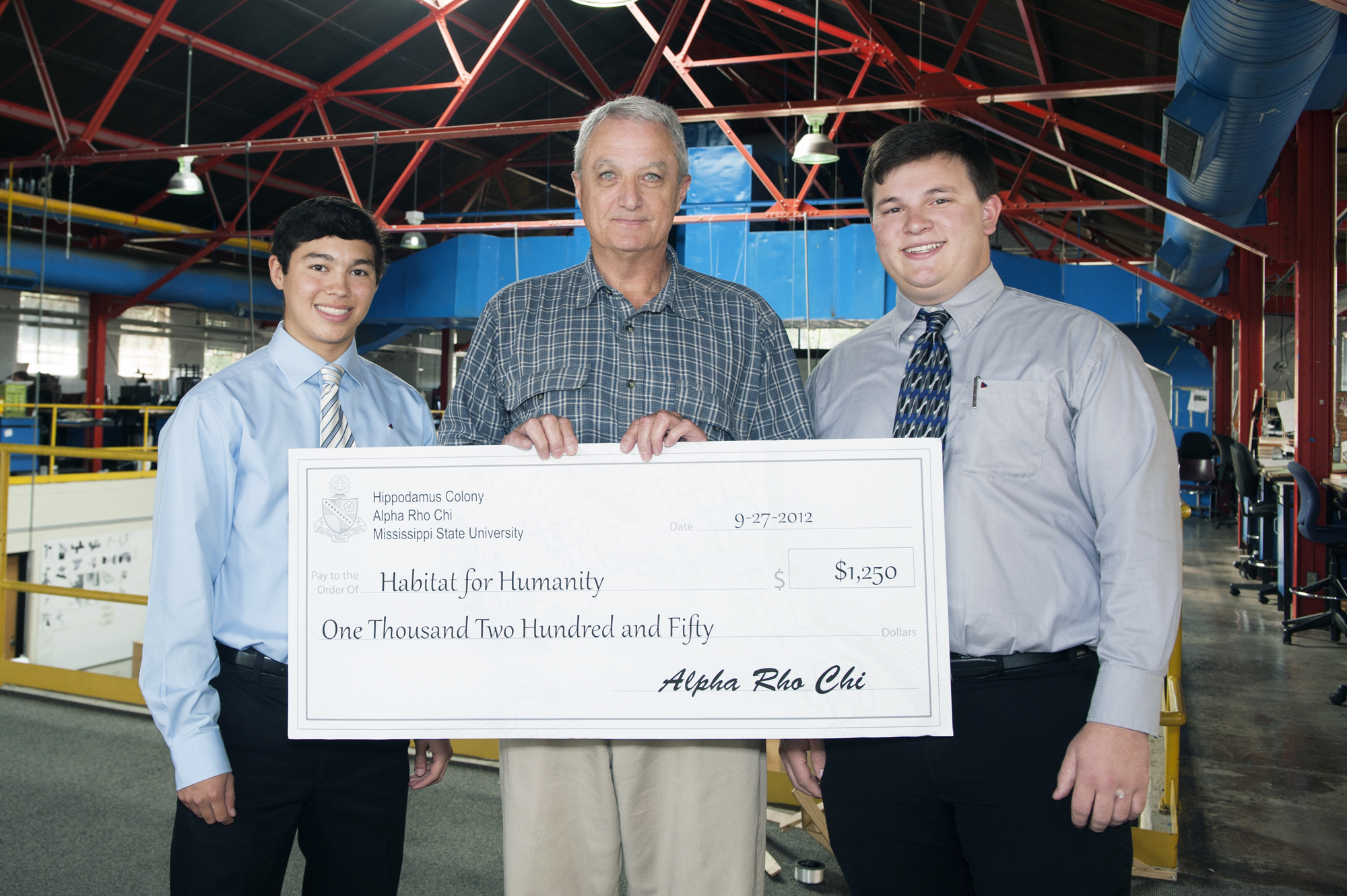 Mississippi State University's Alpha Rho Chi fraternity donated $1,250 to Starkville Area Habitat for Humanity. From left are Daniel Torres, fraternity fundraising chairman; Freddie Rasberry, Habitat executive director; and Adam Rhoades, fraternity chapter president.