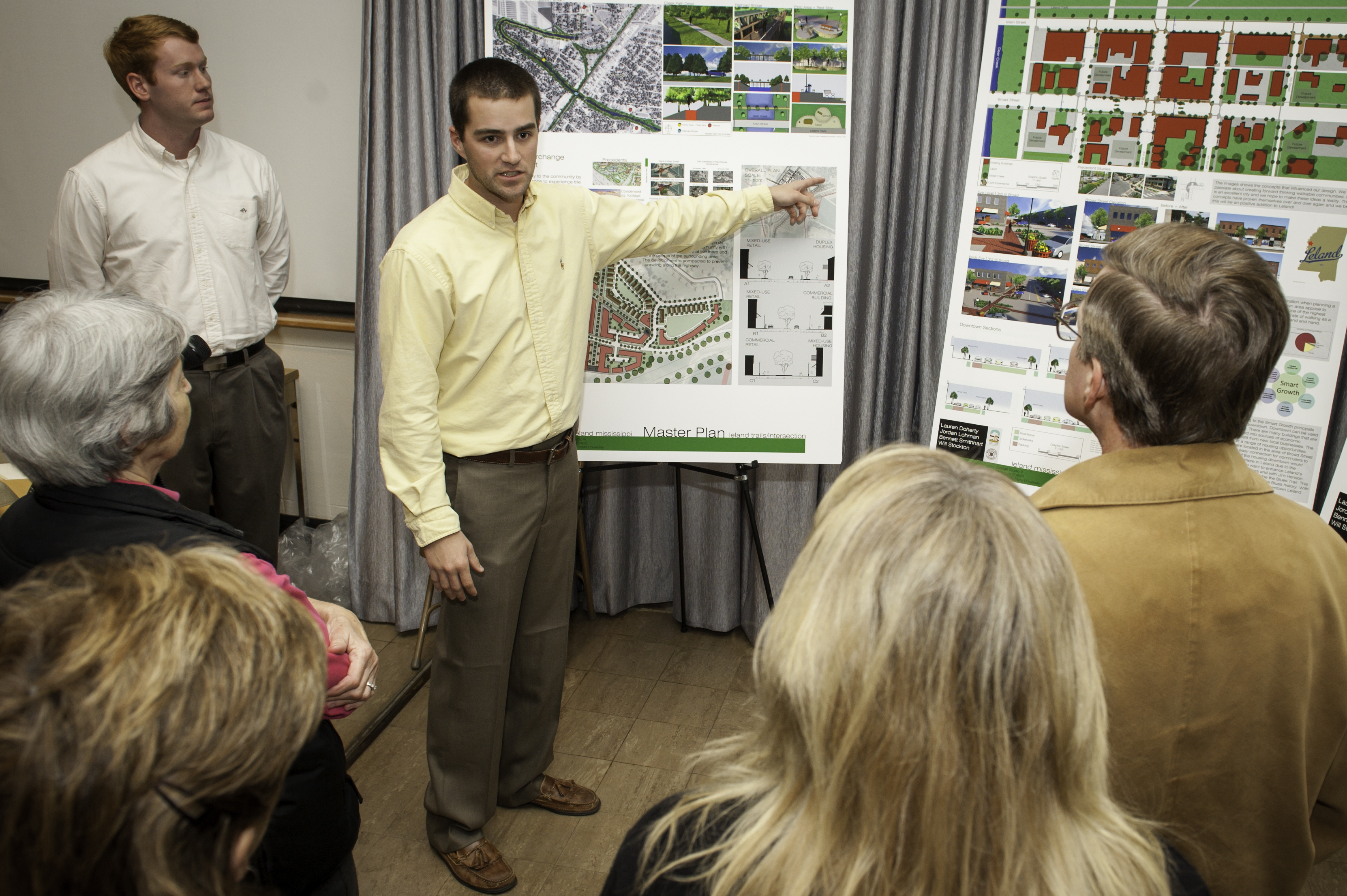 Bennett Smithhard of Brandon, back left, watches his Mississippi State University classmate Will Stockton of Hernando explain community development ideas to Leland residents during their landscape architecture class's recent visit to the Delta community.