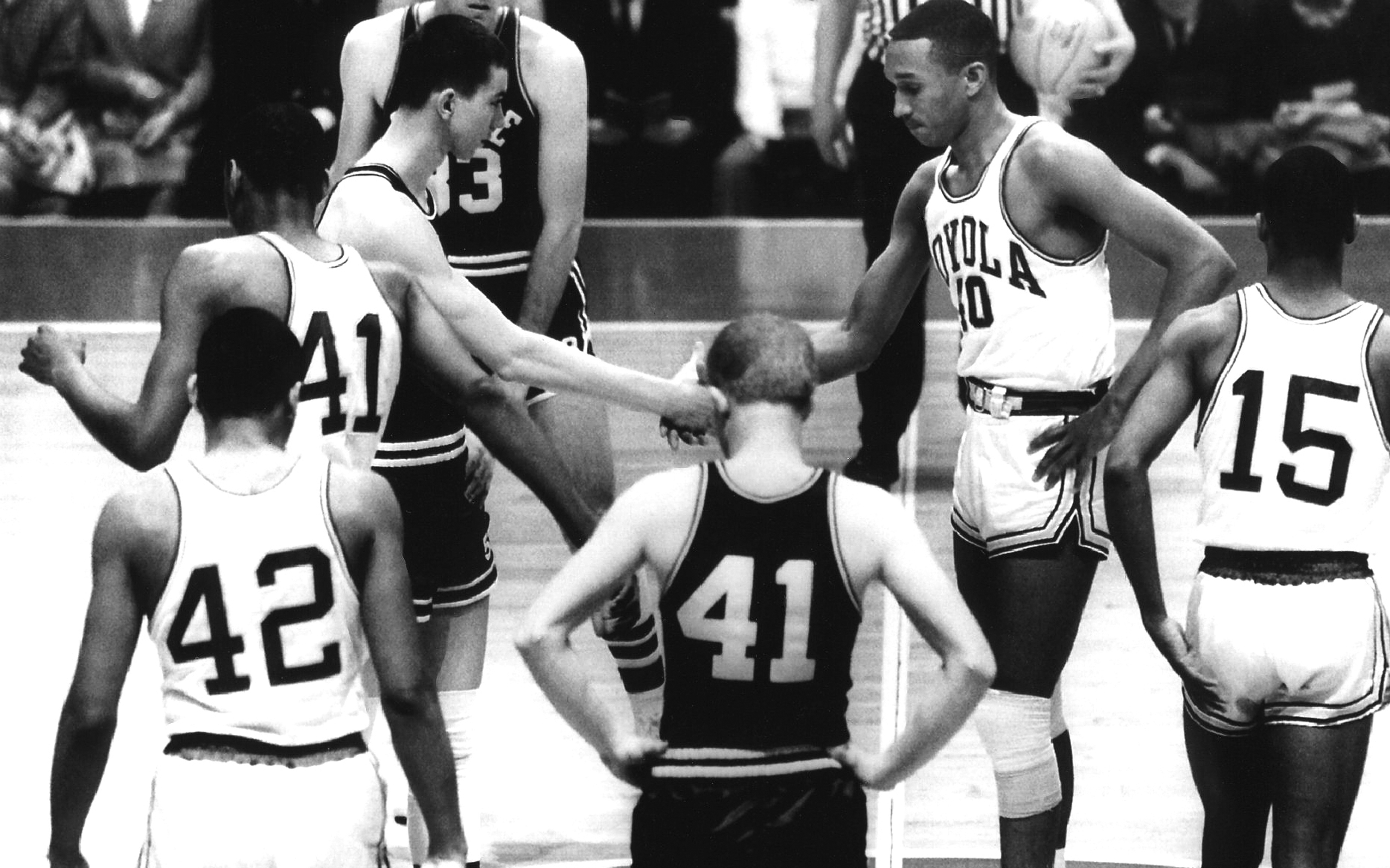 <br /><br />
On March 15, 1963, Mississippi State University's Joe Dan Gold, left, shook hands with Loyola University Chicago's Jerry Harkness before MSU's first NCAA basketball tournament game. The Ramblers beat the Bulldogs 61-51 on that historic day.<br /><br />
