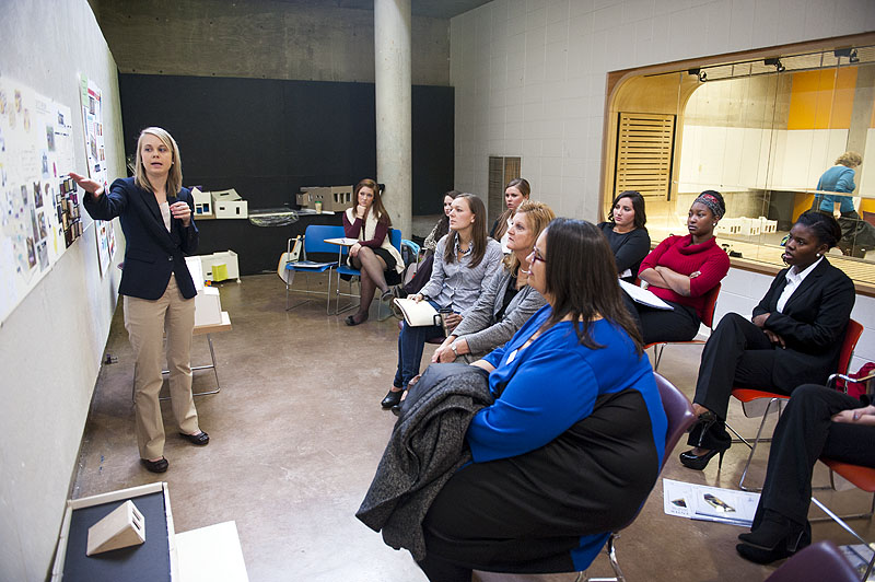 MSU junior Lauren Henson, left, explains her interior design ideas for a conceptual adult literacy center, inspired by her class's visit to the New Orleans YMCA Adult Literacy Program at the beginning of the semester.