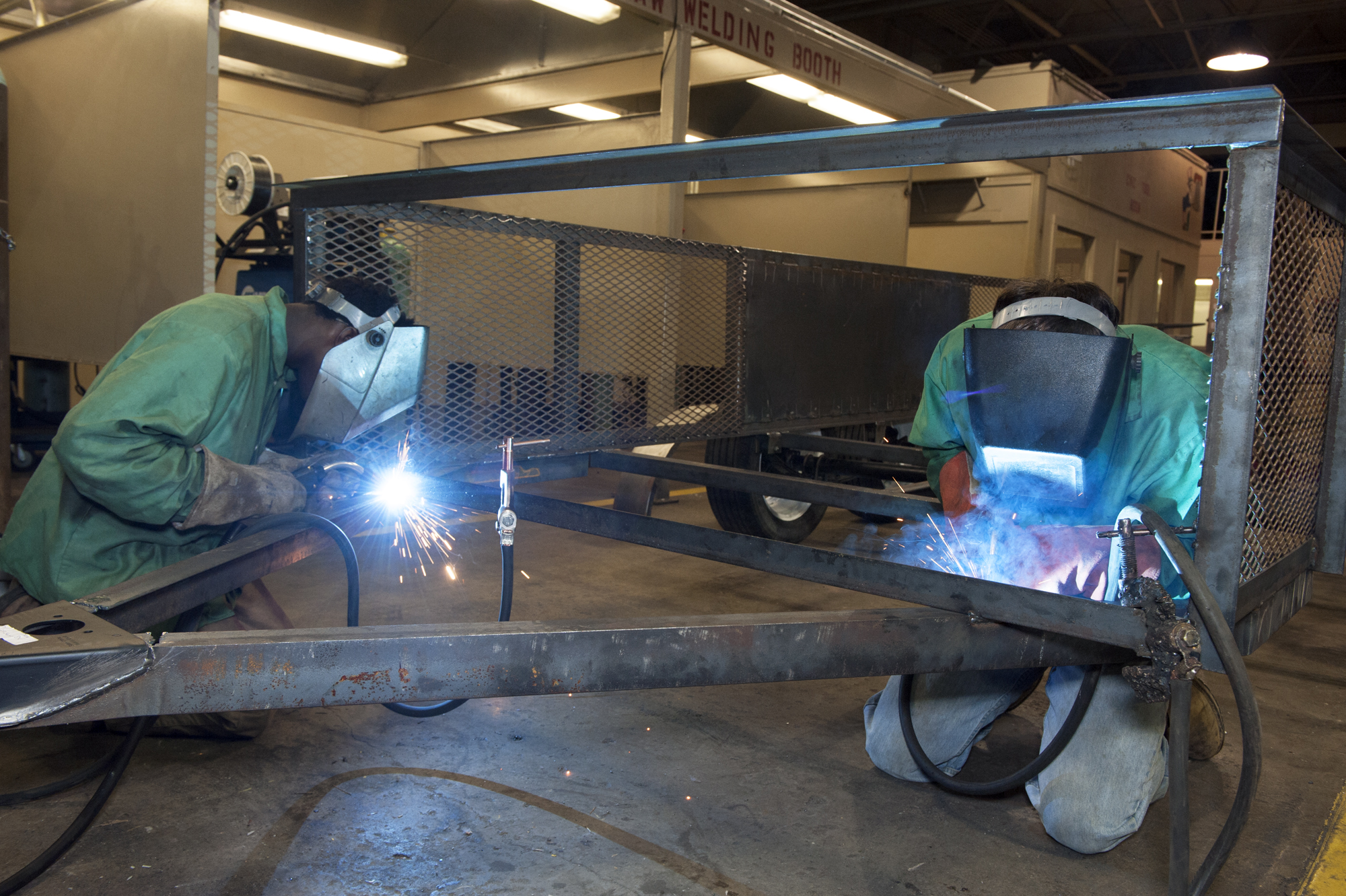 Junior LaThomas Brown, left, and senior Dillon Copeland show off the welding skills they've been learning in the metal fabrication class at Louisville High School. The young men are benefiting from their school's partnership with the local community, fostered by Mississippi State University's Stennis Institute.