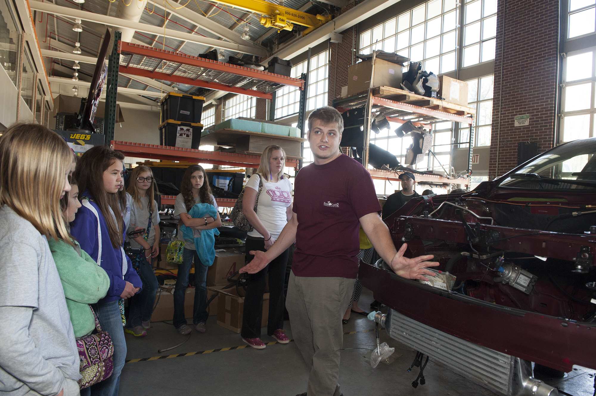 Tom Goddette, a mechanical engineering graduate student and five-year veteran of EcoCAR 2 and the preceding EcoCAR competitions talks to a tour group of elementary students from DeSoto County who came to see the team's work at MSU's Center for Automotive and Vehicular Systems during the spring semester.