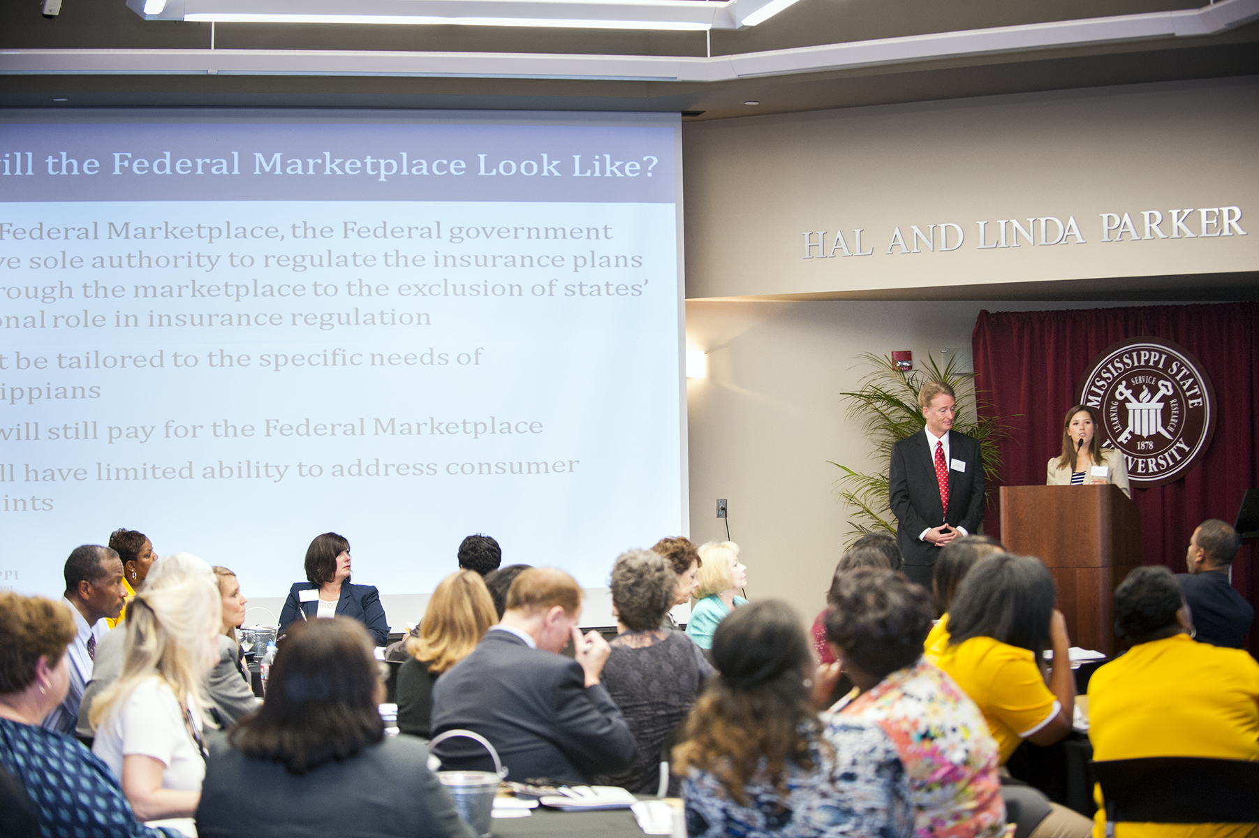 Maris Cooper, right, along with her colleague Bob Williams of the Mississippi Insurance Department, addresses participants of the first IHL Human Resources Staff Conference at Mississippi State's Hunter Henry Center Tuesday. Cooper and Williams gave an overview of the Affordable Care Act and were among several speakers throughout the day to address timely topics of interest to HR professionals.