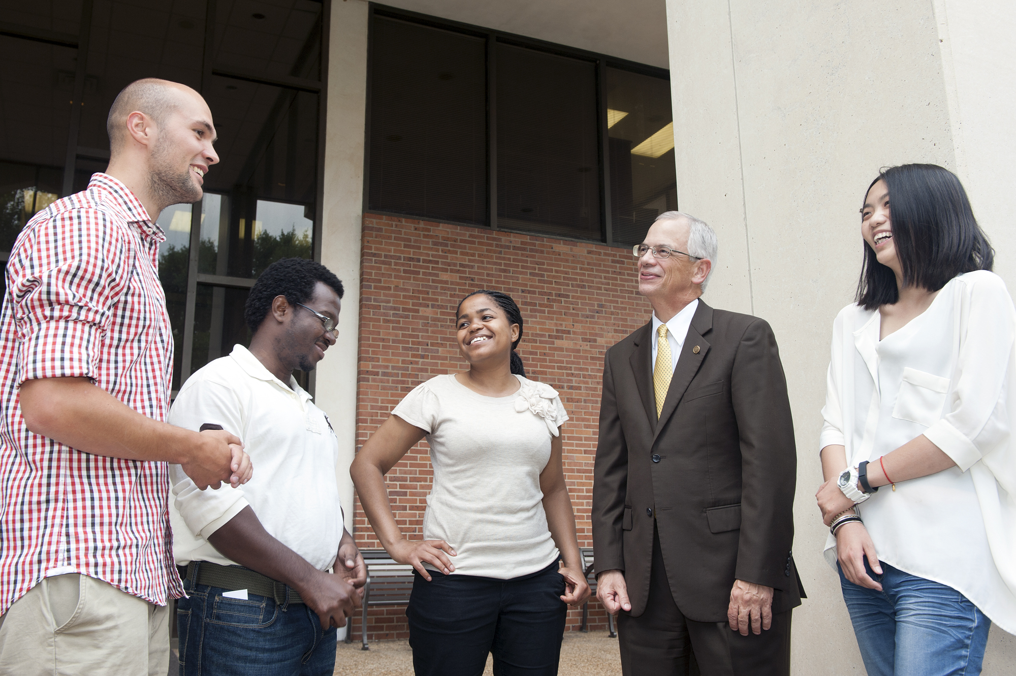 New Fulbright scholars discuss their experiences that brought them to continue their studies at MSU. From left,  Maximilian Roethig of Germany, Ralph Antoine Vital of Haiti, Kentse Radebe of South Africa, MSU Provost and Executive Vice President Jerry Gilbert, and Jing Yang of China.