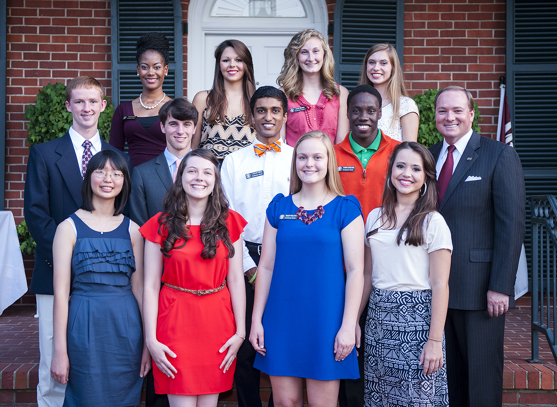 Pictured with MSU President Mark E. Keenum, far right, the university's newest class of Presidential Scholars include, first row from left, Sallie Lin, Emily Damm, Haley Wilcutt and Holly Travis; second row, Max Moseley, Jack Bryan, Aalaap Desai and Rodney Kipchumba; and third row, Natalie Jones, Kim Kelly, Allie Brown, and Roxanne Raven.