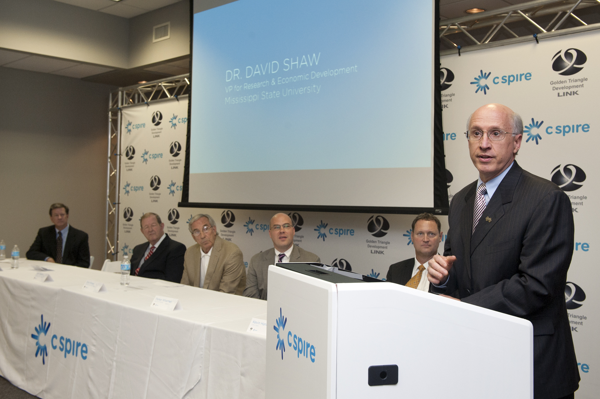 David Shaw (right), vice president for research and economic development at Mississippi State University, joined local elected officials, economic developers and company executives Thursday afternoon for C Spire's announcement that the Ridgeland-based company will build a state-of-the-art data center in the Cochran Research Park.