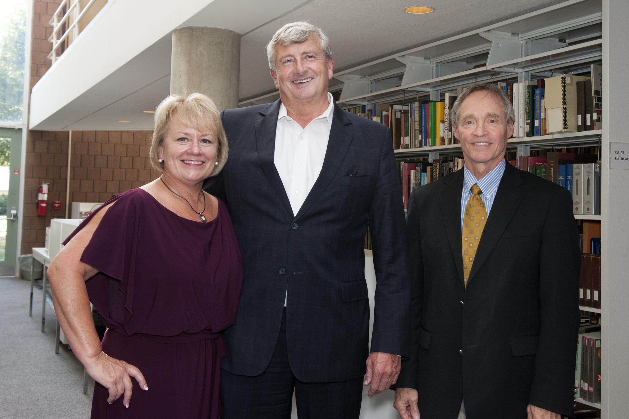 Bob and Kathy Luke of Meridian stand with Jim West, right, dean of the College of Architecture, Art and Design, at the Bob and Kathy Luke Library in Giles Hall.