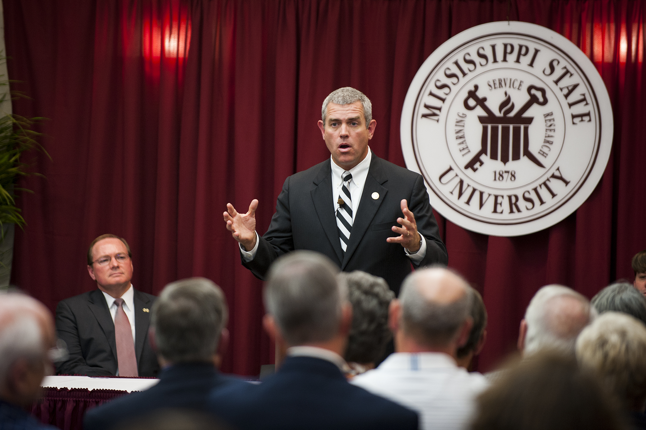 Mississippi House Speaker Philip Gunn addresses a crowd as MSU President Mark E. Keenum looks on during the "Mississippi Solutions--an Idea Tour."