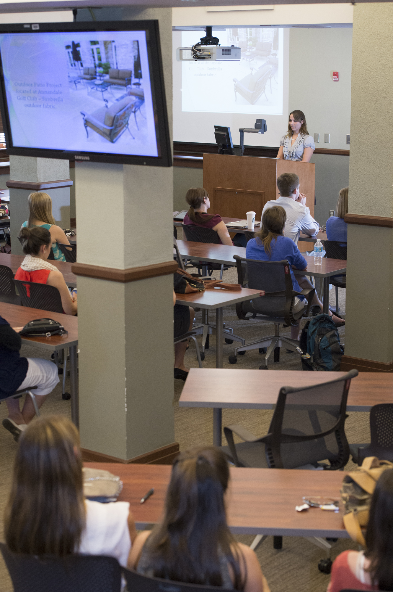 MSU senior Elizabeth "Corley" Ingram, daughter of David and Betsy Ingram of Brandon, gives a presentation about her interior design internship at Upholstery by Design in Jackson. 