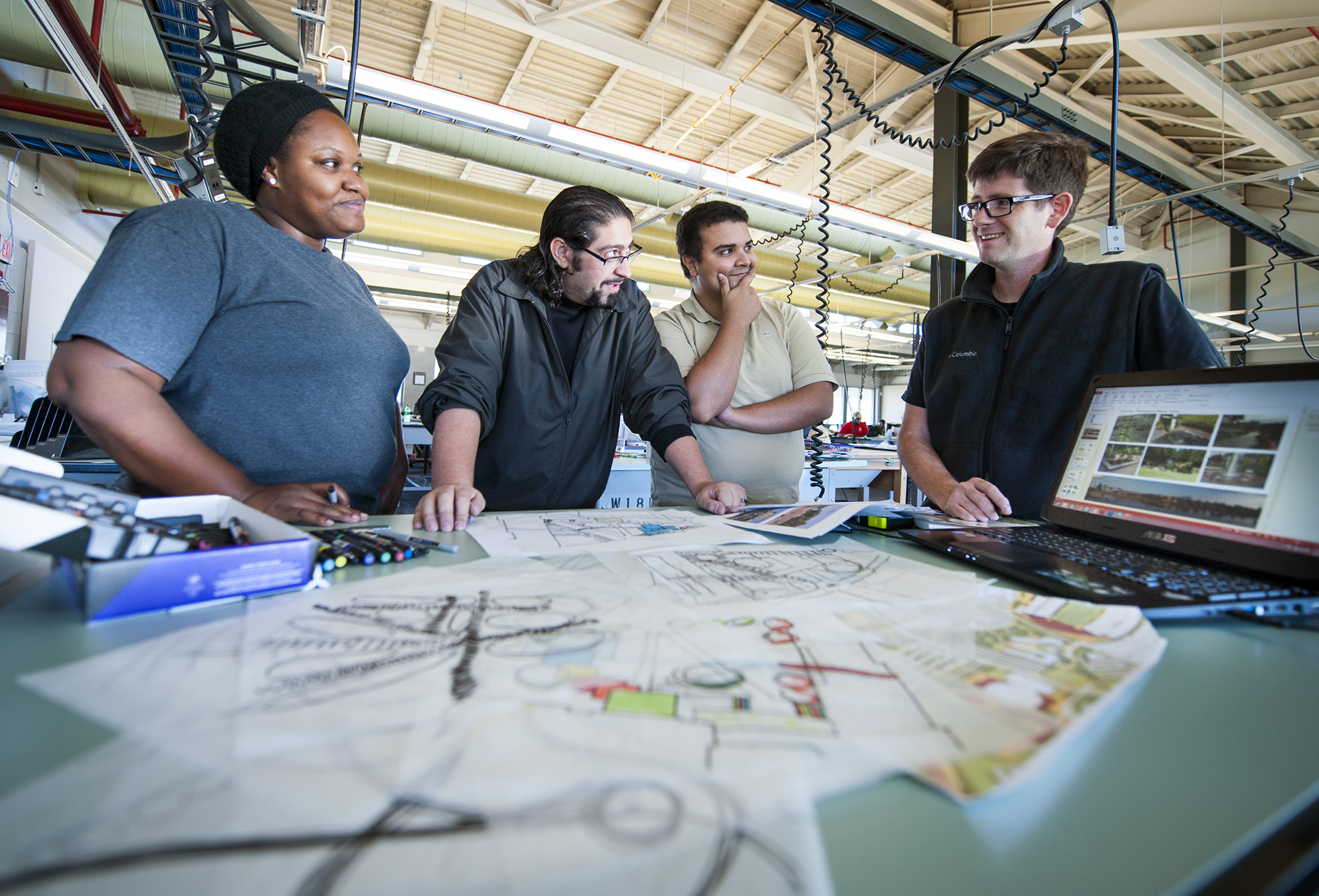 Mississippi State University students participating in the EPA's Campus RainWorks Challenge include, from left, Juriel Rogers of Alabama, and Yazan Mahadin and Anas Bdour of Jordan, respectively. Assistant landscape architecture professor Cory Gallo, right, is a team adviser.