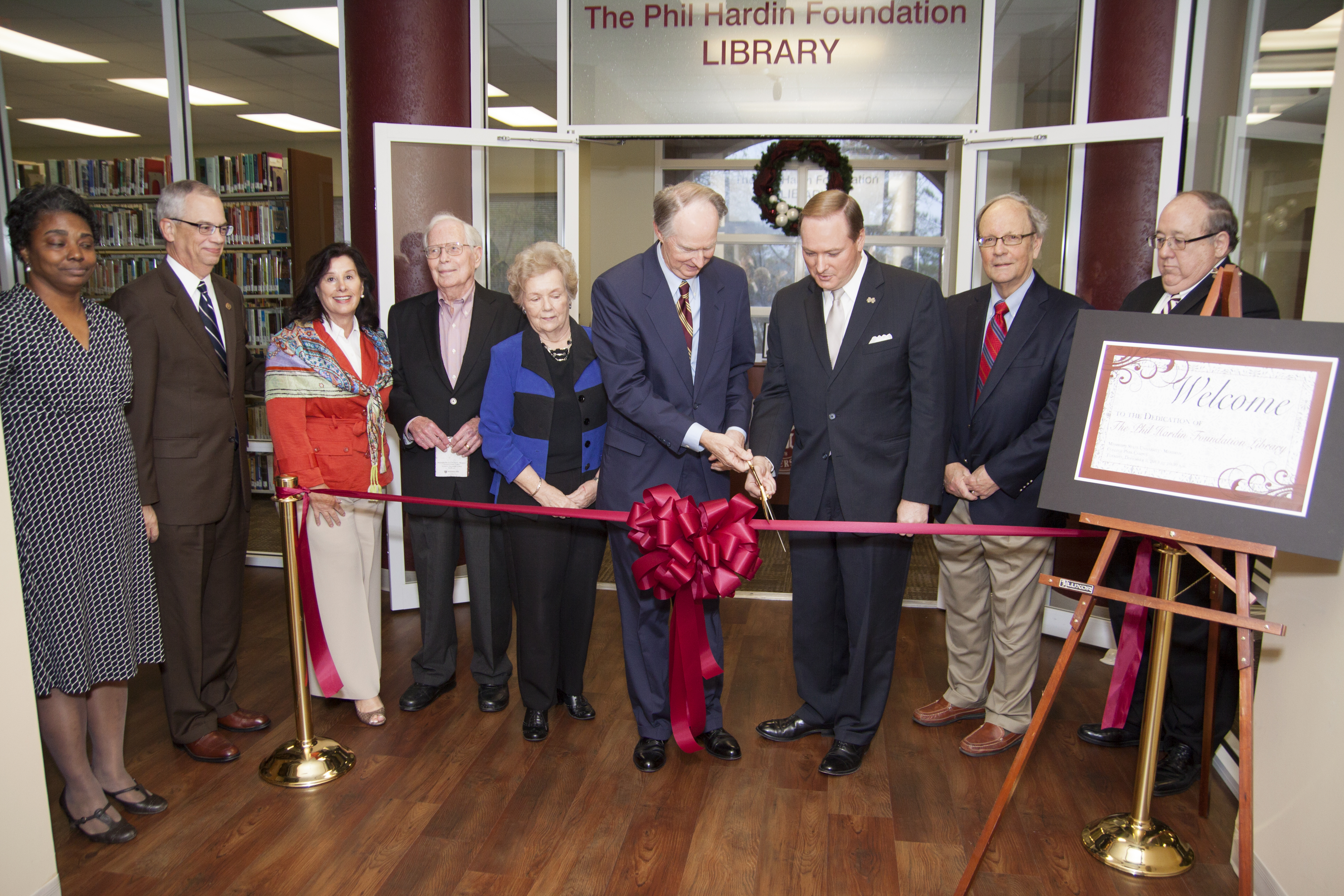 Taking part in the dedication and ribbon cutting of the Phil Hardin Foundation Library at the Mississippi State University - Meridian College Park campus on Tuesday were, left to right: Melanie Thomas, MSU-Meridian Library Services Coordinator; MSU Provost Jerry Gilbert; Hardin Foundation executive director Rebecca Combs-Dulaney; Hardin Foundation director Robert B. Deen Jr.; MSU Dean of Libraries Frances N. Coleman;  Hardin Foundation Board of Directors President Robert F. Ward; MSU President Mark E. Keenum;  Hardin Foundation director Stephen O. Moore; and Steven F. Brown, Dean of MSU-Meridian.