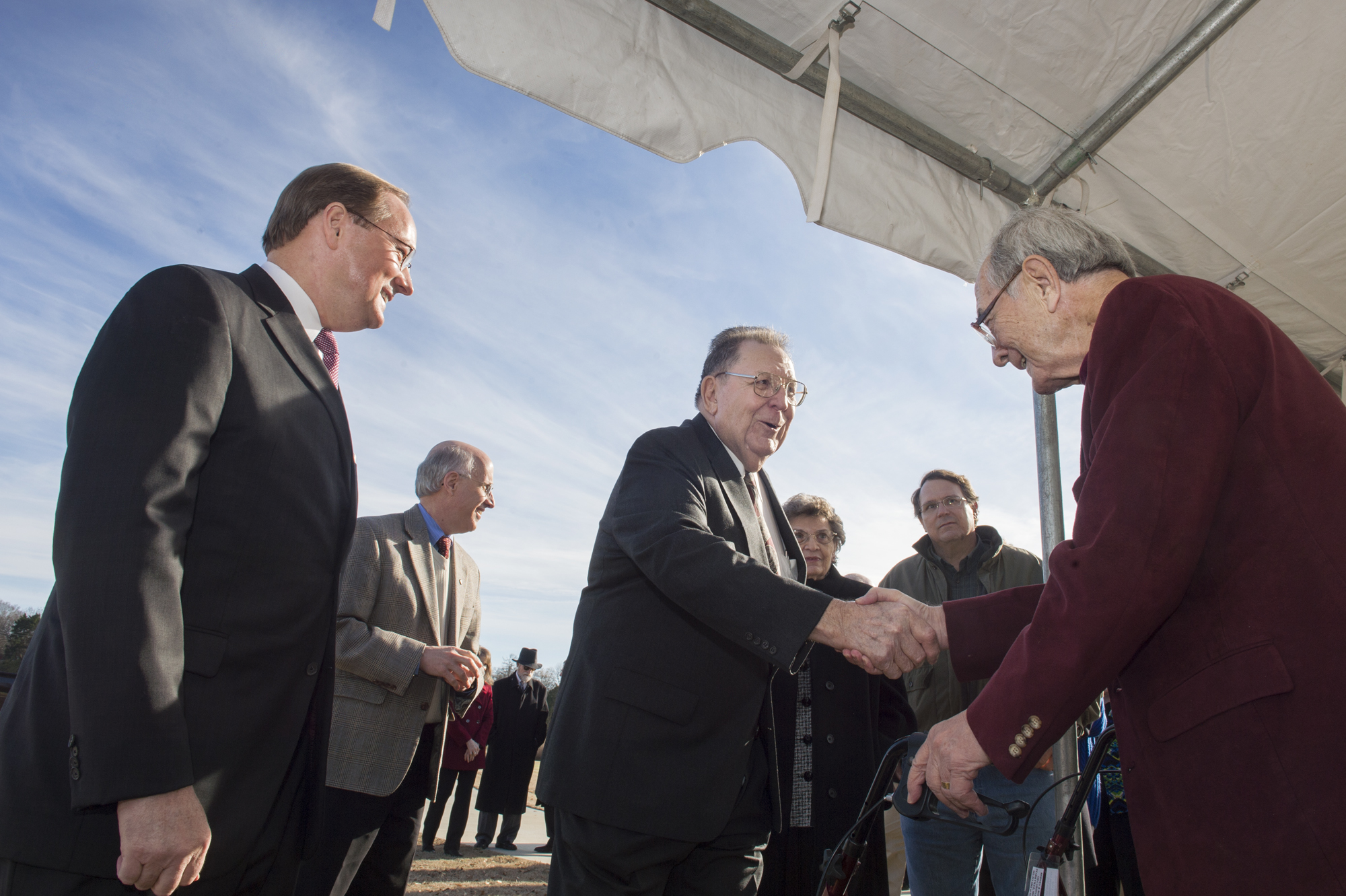 MSU President Mark E. Keenum looks on as Verner Hurt greets Rodney Foil Wednesday during a dedication ceremony held in their honor.