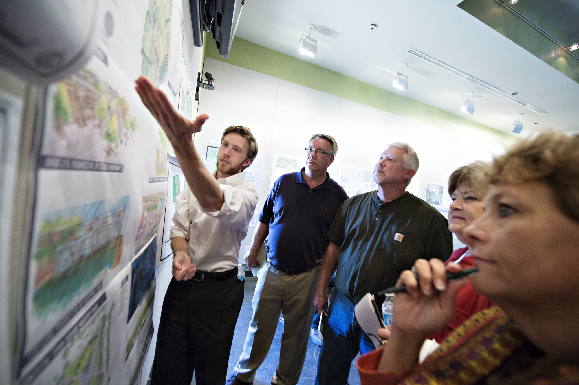 Mississippi State landscape architecture senior Kenneth S. "Kenny" Jones, left, son of Kenneth Jones of Southhaven and Tammy Jones of Ackerman, shows Pontotoc officials his design plans for a park between Tanglefoot Trail and the downtown. From left, city representatives included Mayor Jeff Stafford and planner Terry Lynn Donaldson, along with Ellen Russell, Main Street Association director, and Jan Miller, the association's northern district director. 