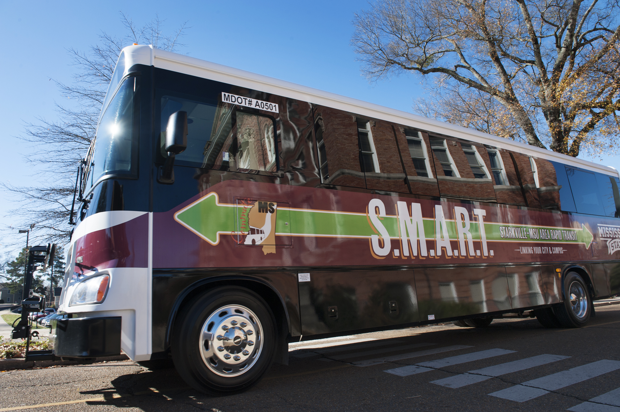 One of 21 buses used to support the S.M.A.R.T. shuttle system drives on campus.