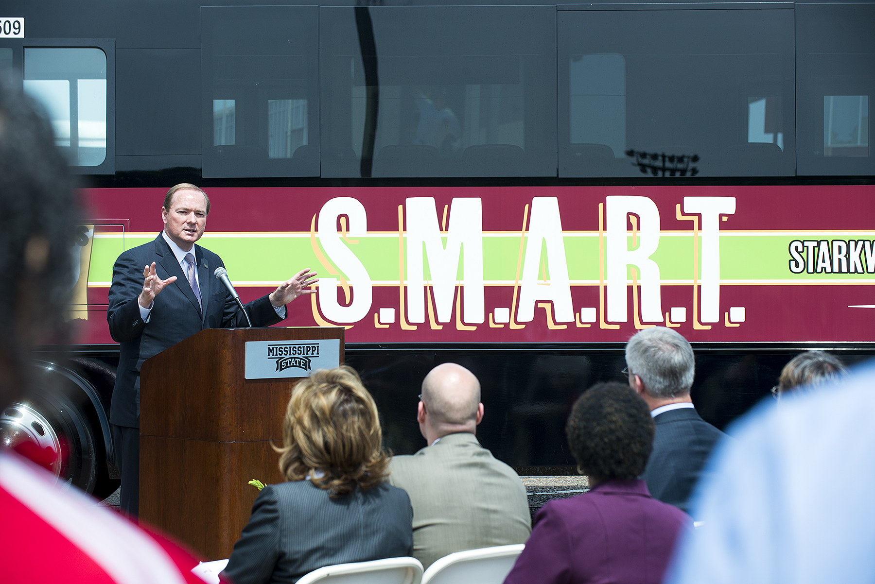 Mississippi State University President Mark E. Keenum explains the advantages of the campus-to-community Starkville-Mississippi State University Area Rapid Transit system at the ribbon-cutting ceremony on Monday at MSU.