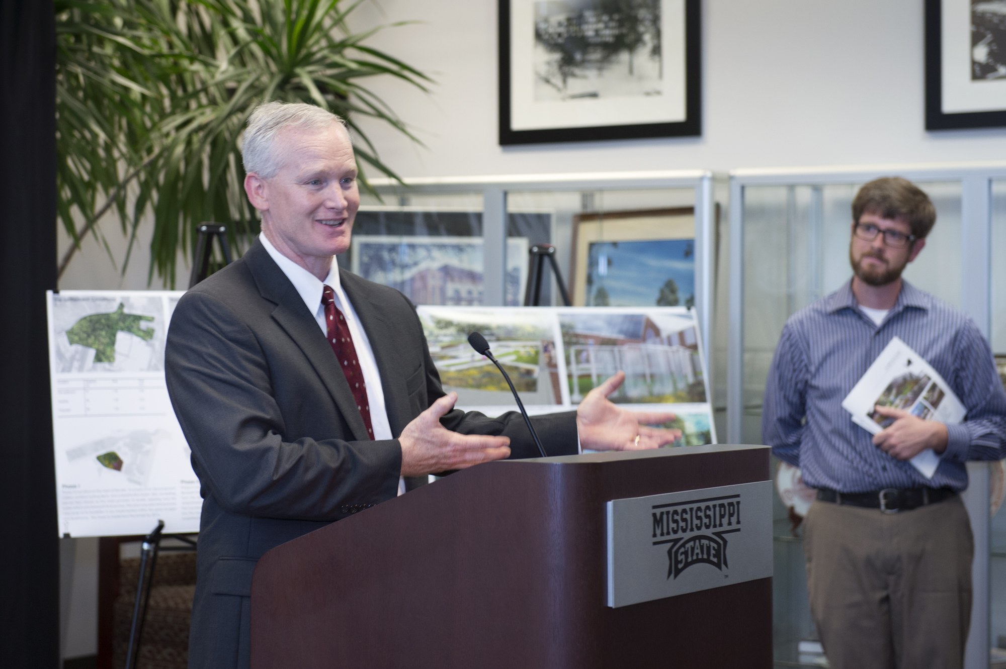 EPA administrator Christopher Thomas, left, congratulates MSU assistant professor Cory Gallo for his student team's second-place win in the Environmental Protection Agency's 2013 Campus Rainworks Challenge.