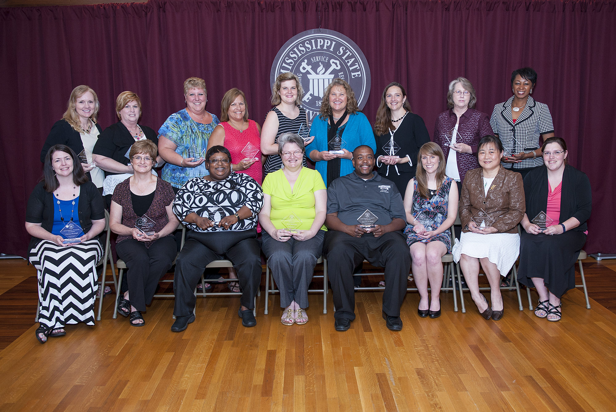 The 2014 graduates of MSU's DAWG administrative training program include (seated, l-r) Christy Bischoff, Janie Taylor, Toni Roberson, Jo McKenzie, Davern Jones, Hannah Burnett, Tan Tsai, Nicole Ivancic, (standing. l-r) Criss Bell, Mary Dikes, Lorie White, Paula Jones, Casey Watts, Karin Lee, Heather Wainwright, Teresa Stewart, and Shlynn Morris. Not pictured is Roslyn Miller. 