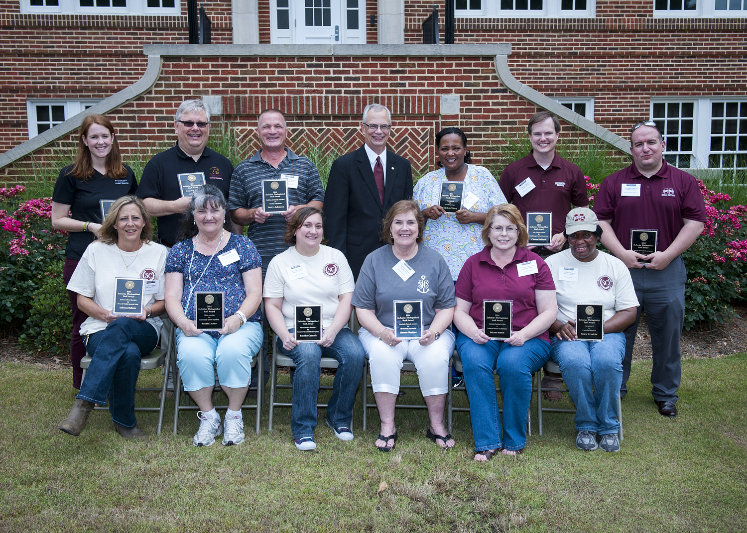 MSU Zacharias Distinguished Staff Award winners for 2014 include (front, l-r) LaDonna Bullman, Bonnie Ladner, Jennifer Carruth, Sharon Hankins, Delores Hudson, and Mary Franklin; (back, l-r) Jacqueline Mullen, Dennis Sankovich, Terry Johnson, presenter Jerry Gilbert, Cynthia Ward, Chance McDavid, and Dallas Breen.