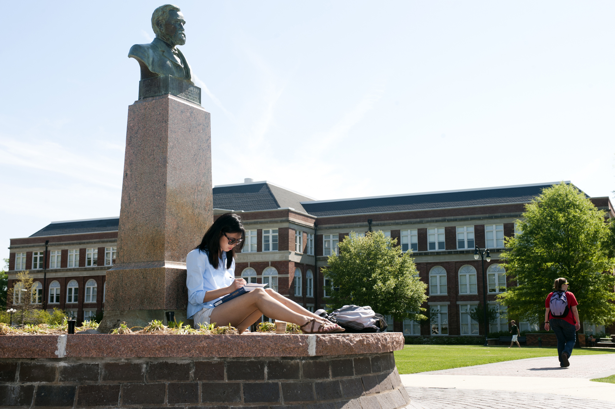 A student studies between classes at the historic bust of MSU's first president Stephen D. Lee. The Student Success Initiative is helping ensure all students are equipped to become lifelong learners and find success during their college careers and beyond.