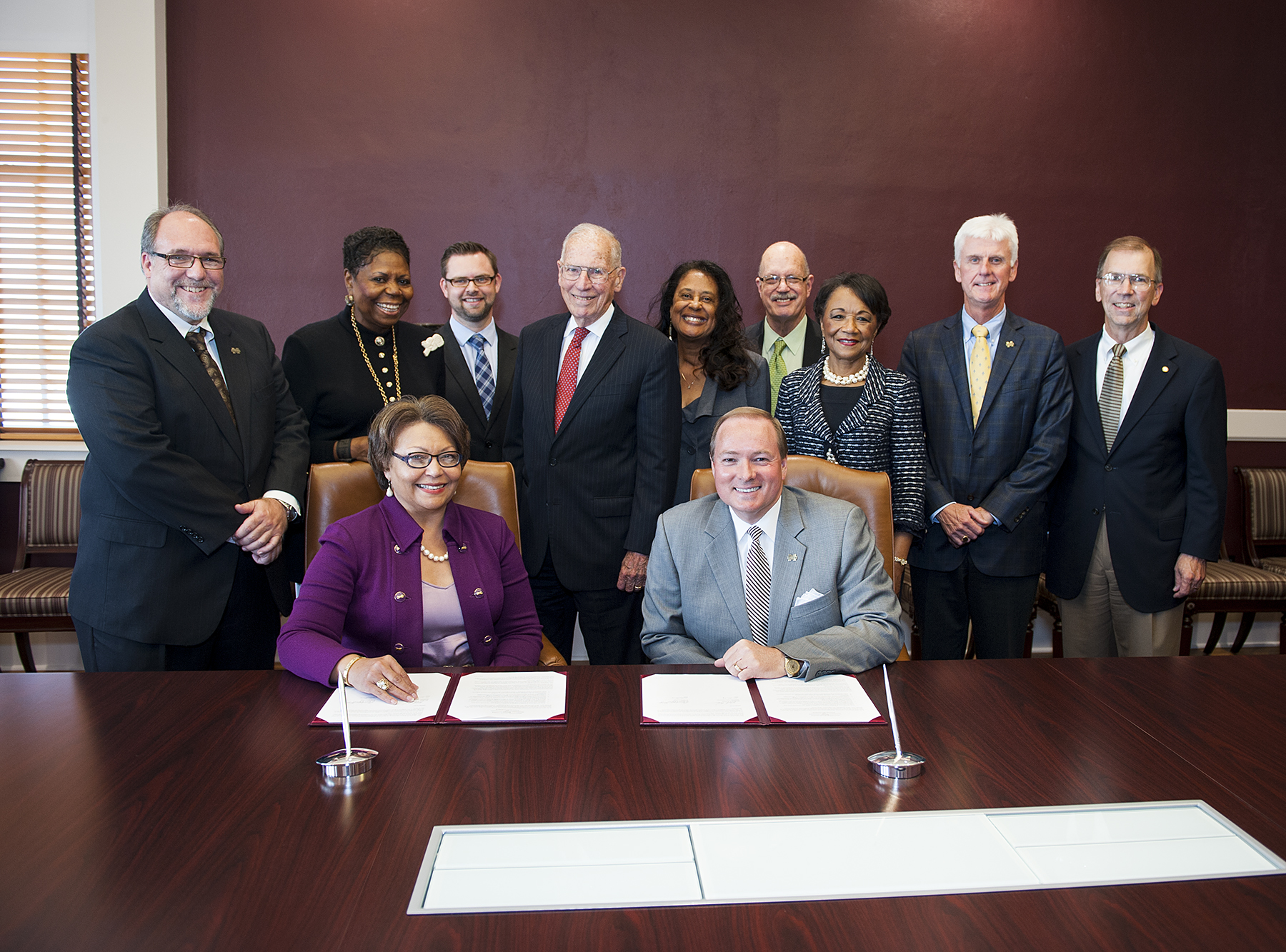 Tougaloo College President Beverly Wade Hogan and MSU President Mark E. Keenum signed a partnership agreement Oct. 20 as representatives of both institutions, as well as former Gov. William Winter, center, looked on. The memorandum of understanding will enhance educational and research opportunities in the fields of science, technology, engineering and mathematics. 