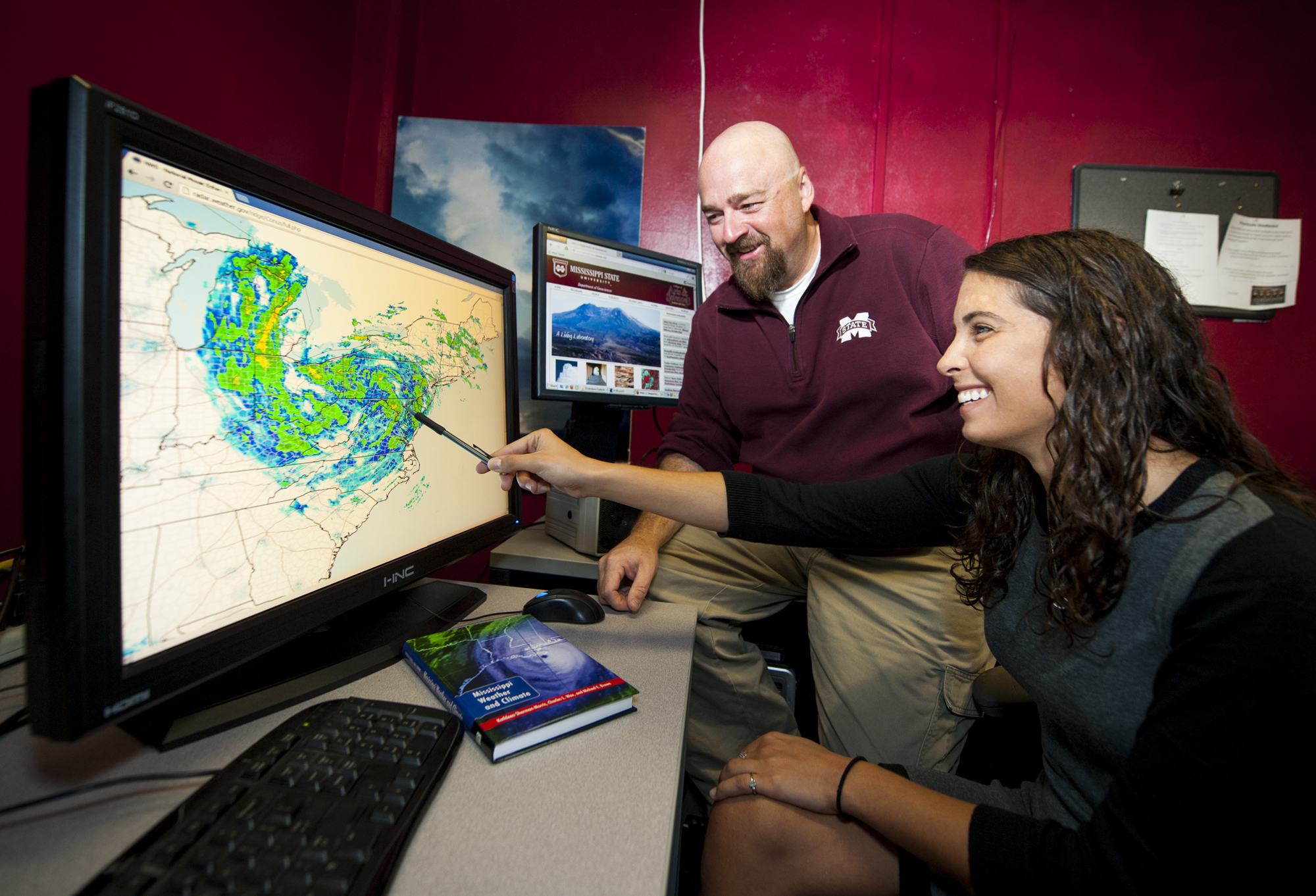 Professor Mike Brown of MSU's geosciences department was honored this week by the National Weather Association. Brown is pictured with former student Rachael Kroot who completed a master's degree in broadcast meteorology this spring.