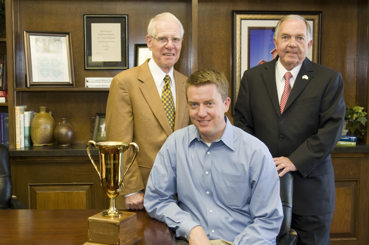 Provost Peter Rabideau (l), athletic director Greg Byrne (c) and Interim President Vance Watson with MSU's latest Halbrook Award.