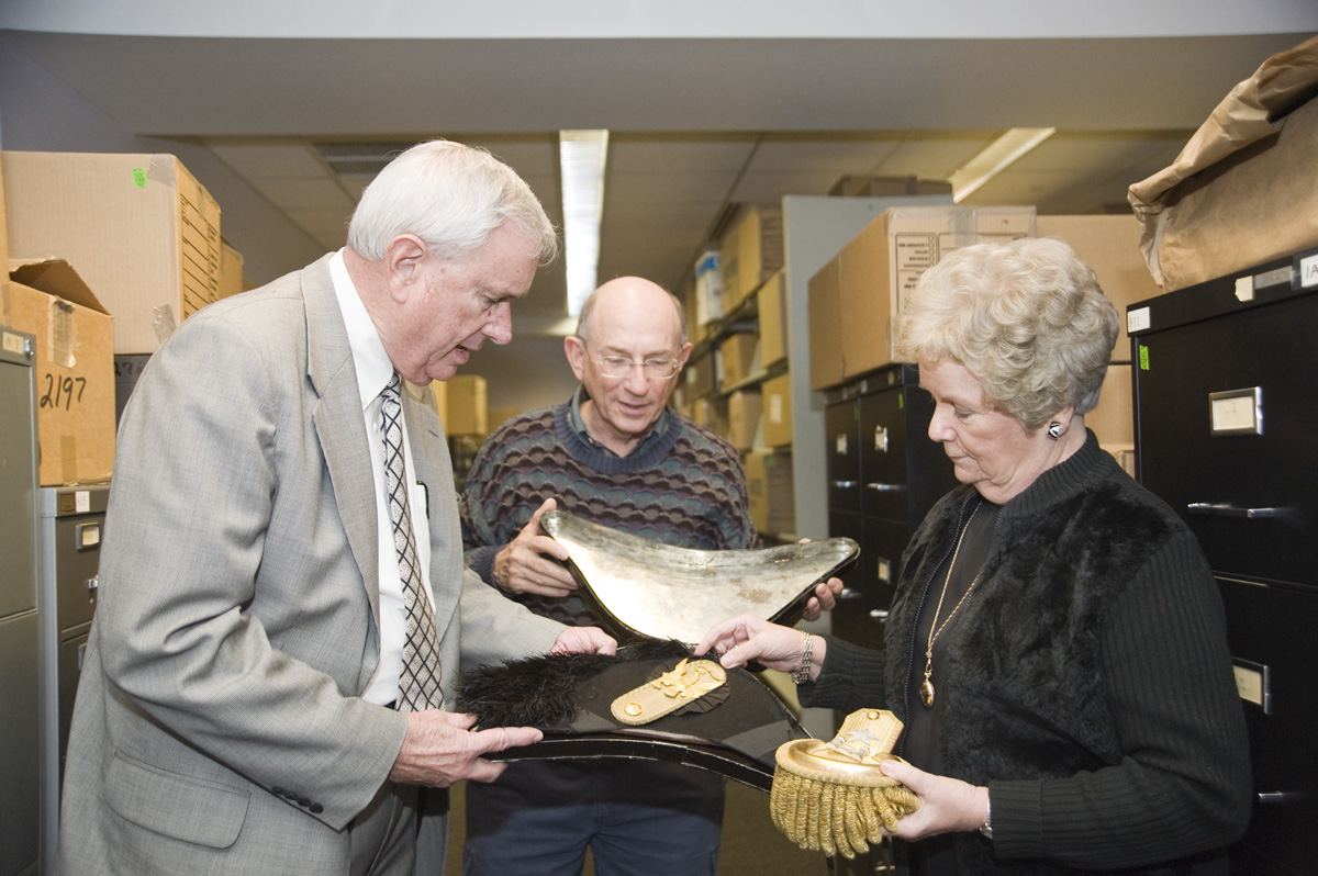 Historian John Marszalek (c), interim Mississippi State President Roy Ruby and Frances Coleman, dean of university libraries, look over artifacts of the U.S. Grant Collection.