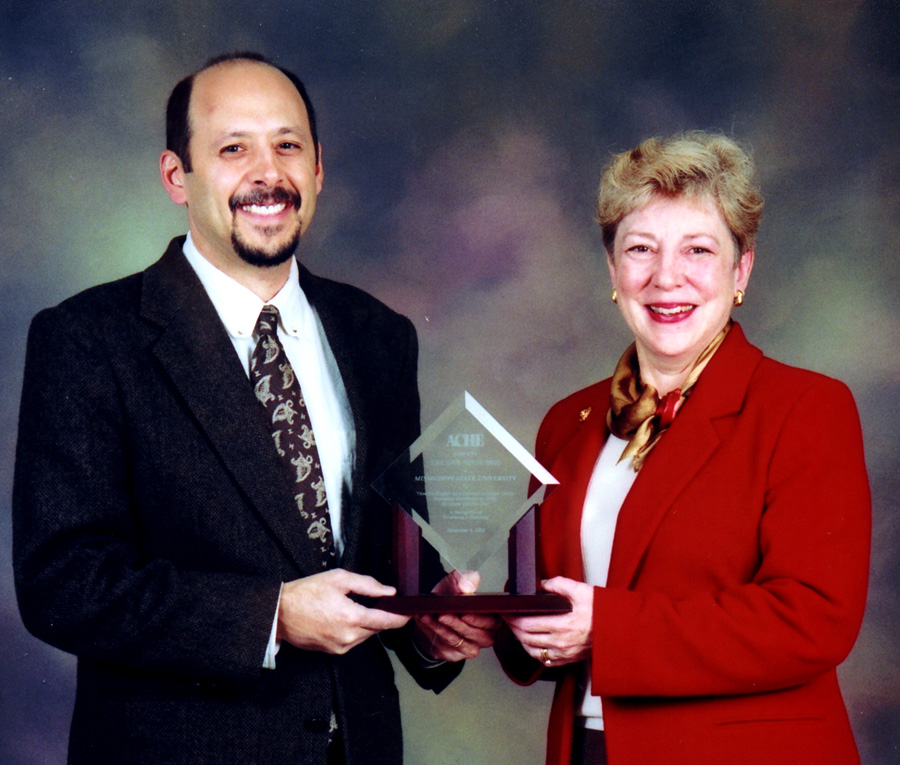 <br /><br />
MSU'S Phil Bonfanti and Fairfax Montgomery display the Crystal Marketing Award. 