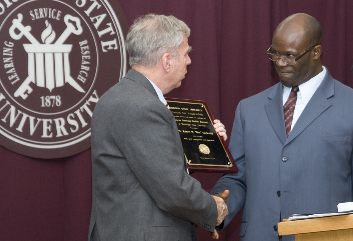 Director Stephen Middleton (r) presented the African-American studies program's first leadership award to MSU President Robert H. "Doc" Foglesong. 