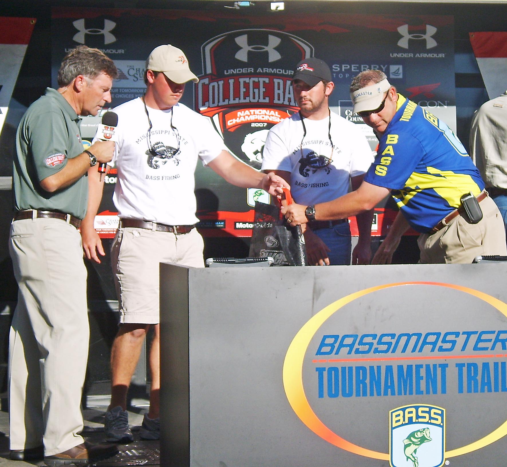 MSU Bass Club anglers Cal Clark (second from left) and Sam Lawrence (second from right) weigh in their catch at the 2007 ESPN Under Armour College Bass National Championship near Little Rock, Ark.