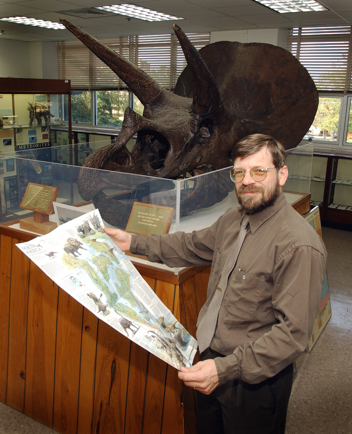 <br /><br />
Chris Dewey and triceratops in MSU's Dunn-Seiler Museum 