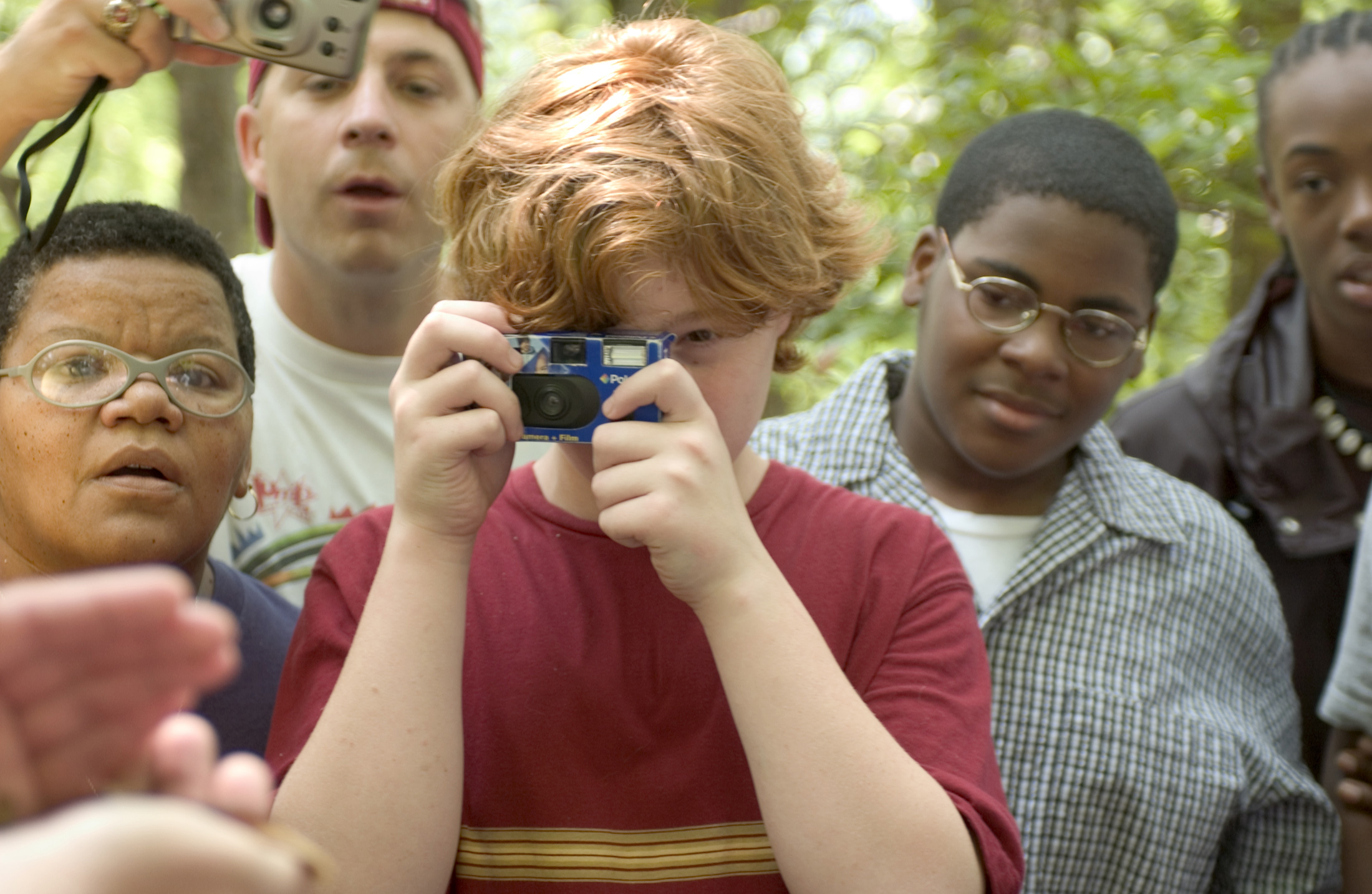 <br /><br />
SALAMANDER UP CLOSE--A hand-held Southern red salamander captured the attention of students and teachers during a recent nature excursion into the woodlands of Jeff Busby State Park in Choctaw County. They were participating in a summer science camp coordinated by Mississippi State's Center for Science Mathematics and Technology. They are (l to r): Cora Straight, a teacher at Starkville's Quad Alternative School Lester Jones, a teacher at Starkville's Armstrong Middle School Hunter Smith of Maben, a rising sixth grader at Henderson School and Michael Wynn and Victor Carr, both rising ninth graders at Starkville High School. 