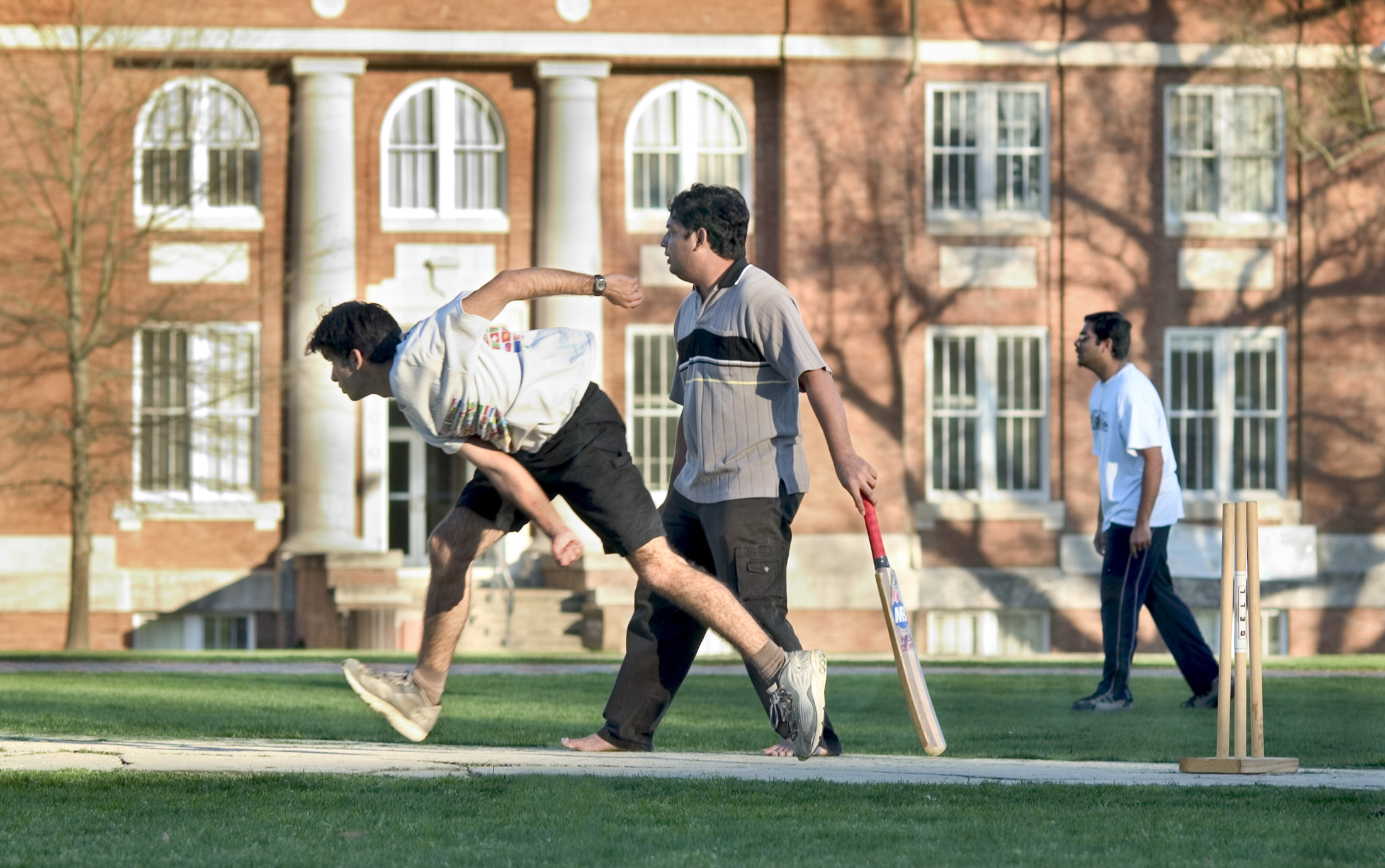 <br /><br />
Members of the MSU Cricket Club practice on the university's Drill Field, site of an Aug. 14 and 15 regional tournament. 