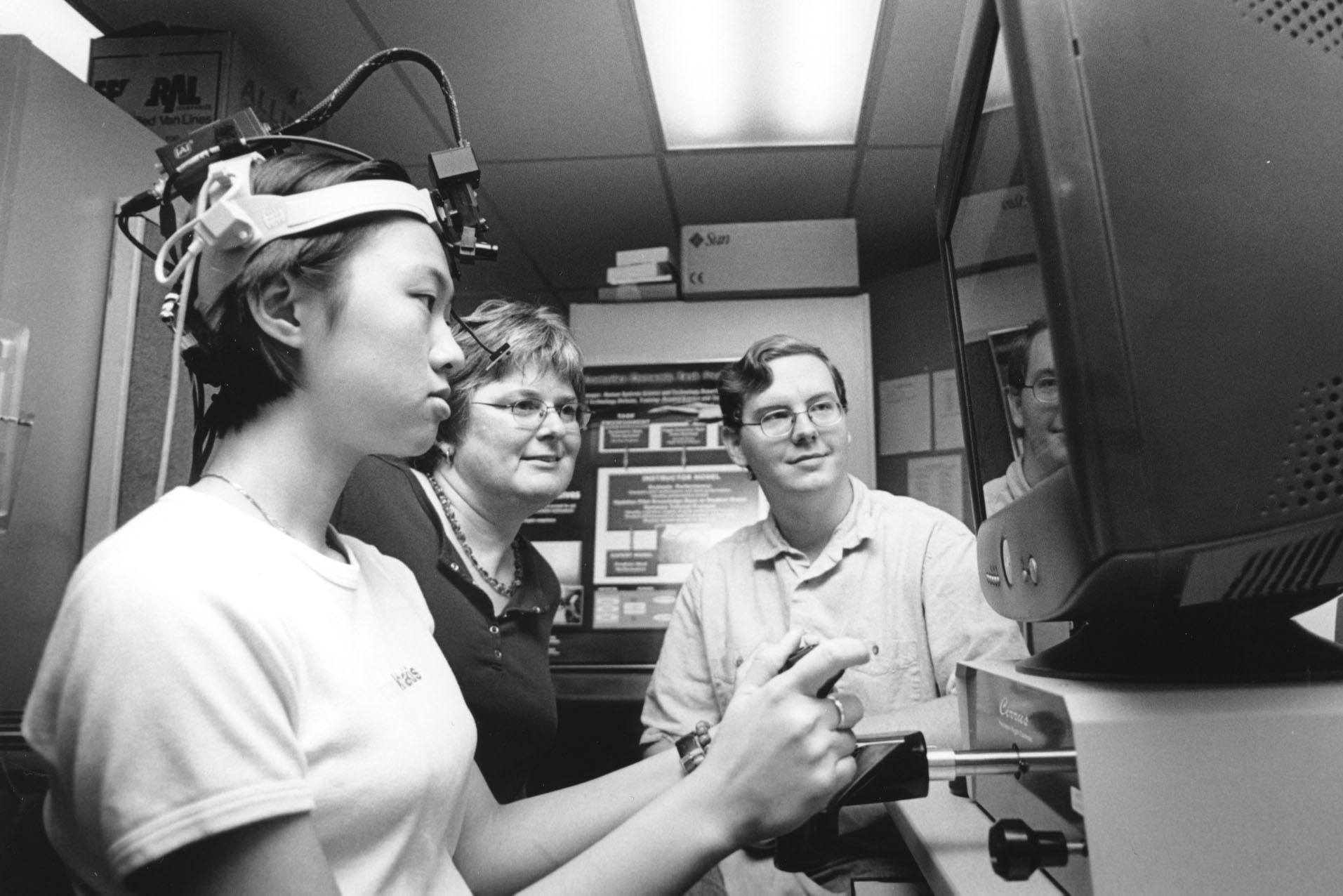 <br /><br />
MSU researcher Stephanie Doane (c) works with students Mei Yee Law and Daniel Carruth to test digital eye-tracking equipment.  