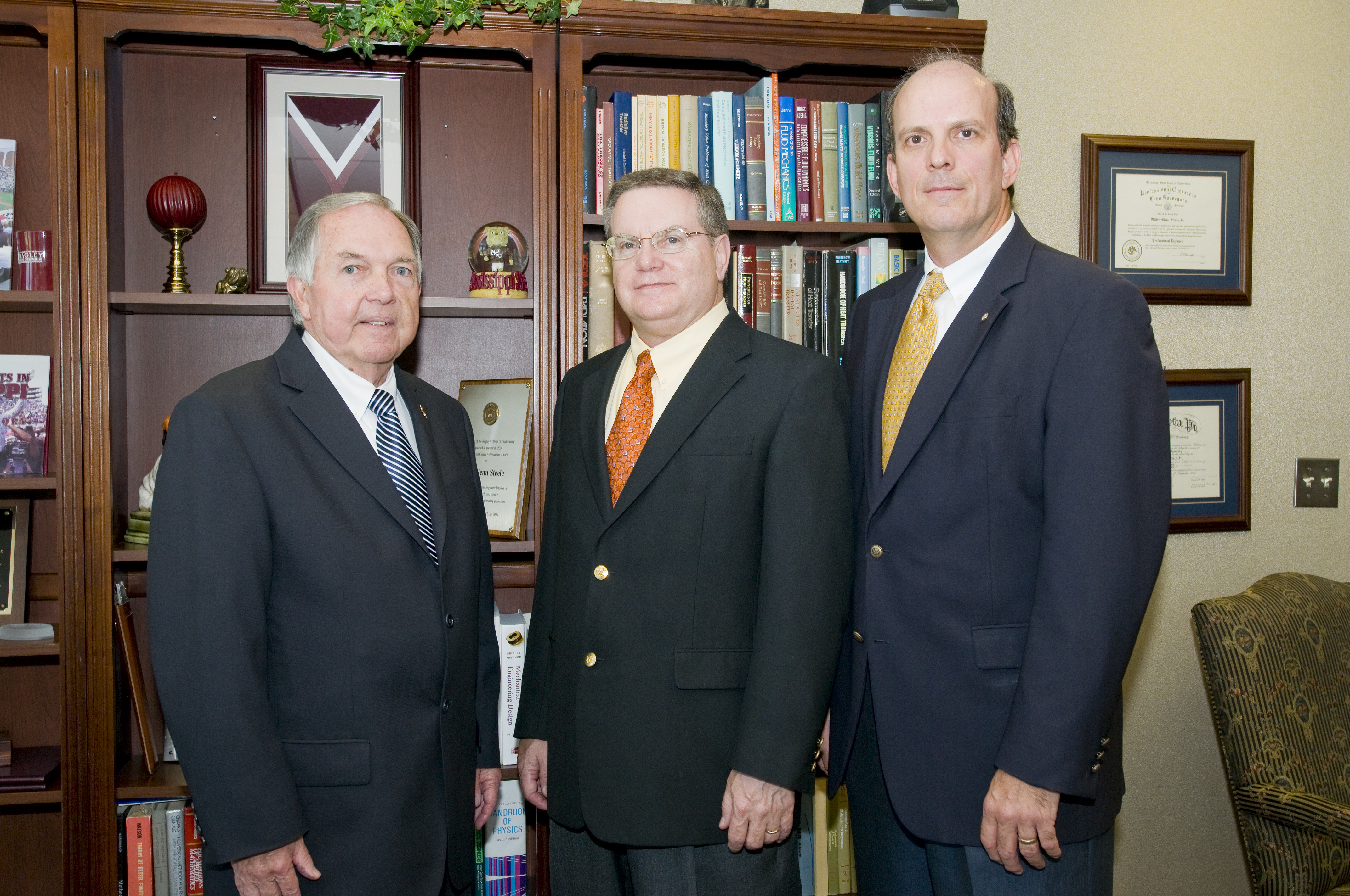 MSU Interim President Vance Watson and interim engineering dean Glenn Steele (c) with Exxon representative Doug Deason, an MSU graduate.