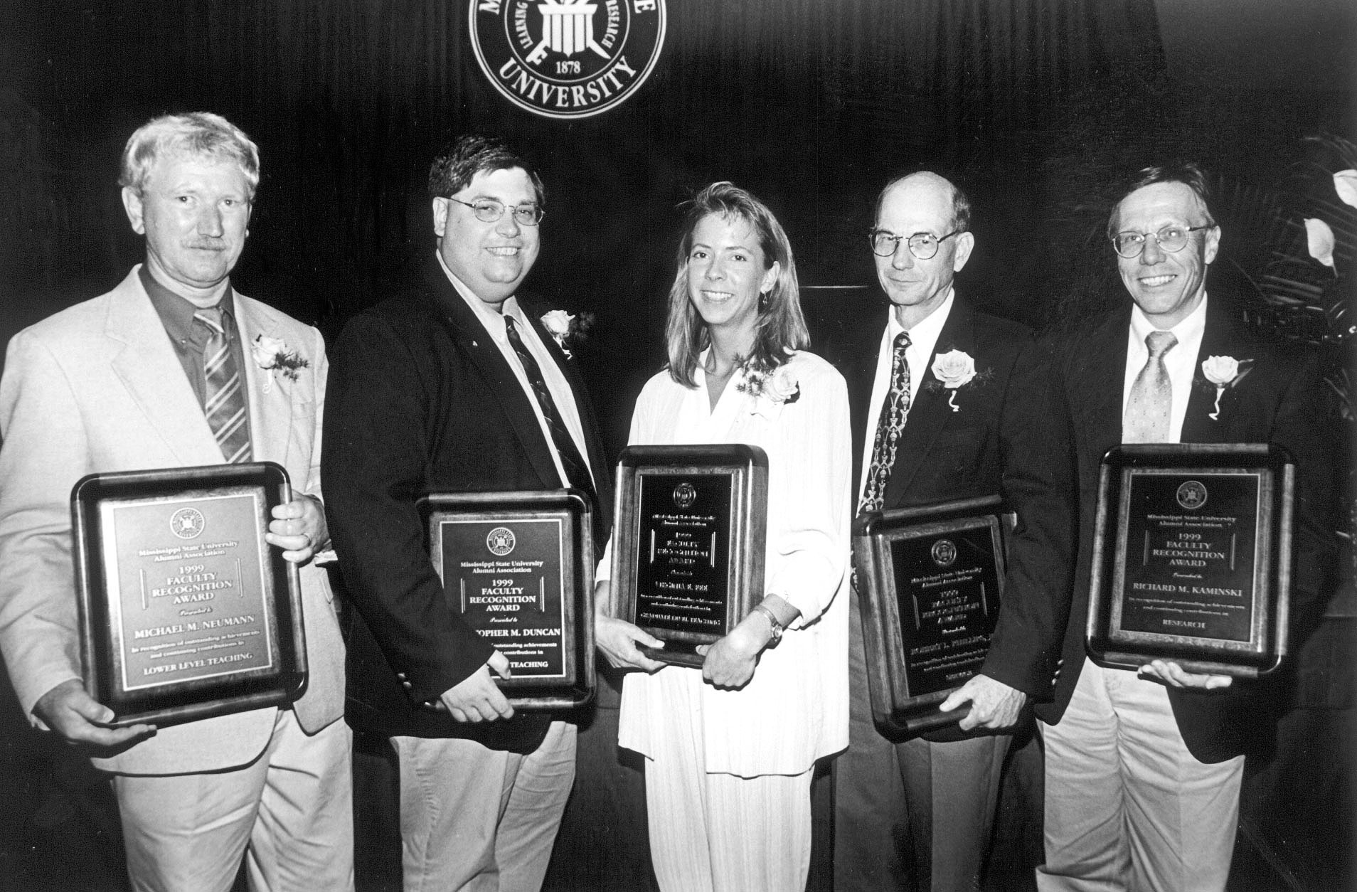 <br /><br />
Receiving 1999 Mississippi State University Alumni Association Faculty Achievement Awards are (l-r) Michael M. Neumann, Christopher M. Duncan, Virginia Fee, Robert L. Phillips Jr., and Richard M. Kaminski.</p><br />
<p>