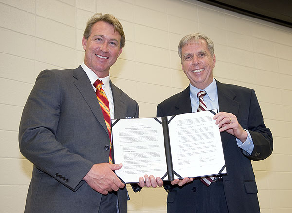 JCJC President Jesse Smith (l) and MSU President Robert H. "Doc" Foglesong display the compact they signed Monday.